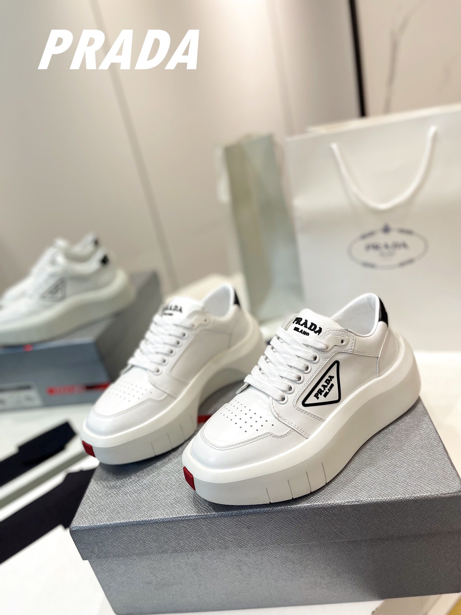 PRADA DOWNTOWN THICK-SOLE SNEAKERS WHITE CALFSKIN