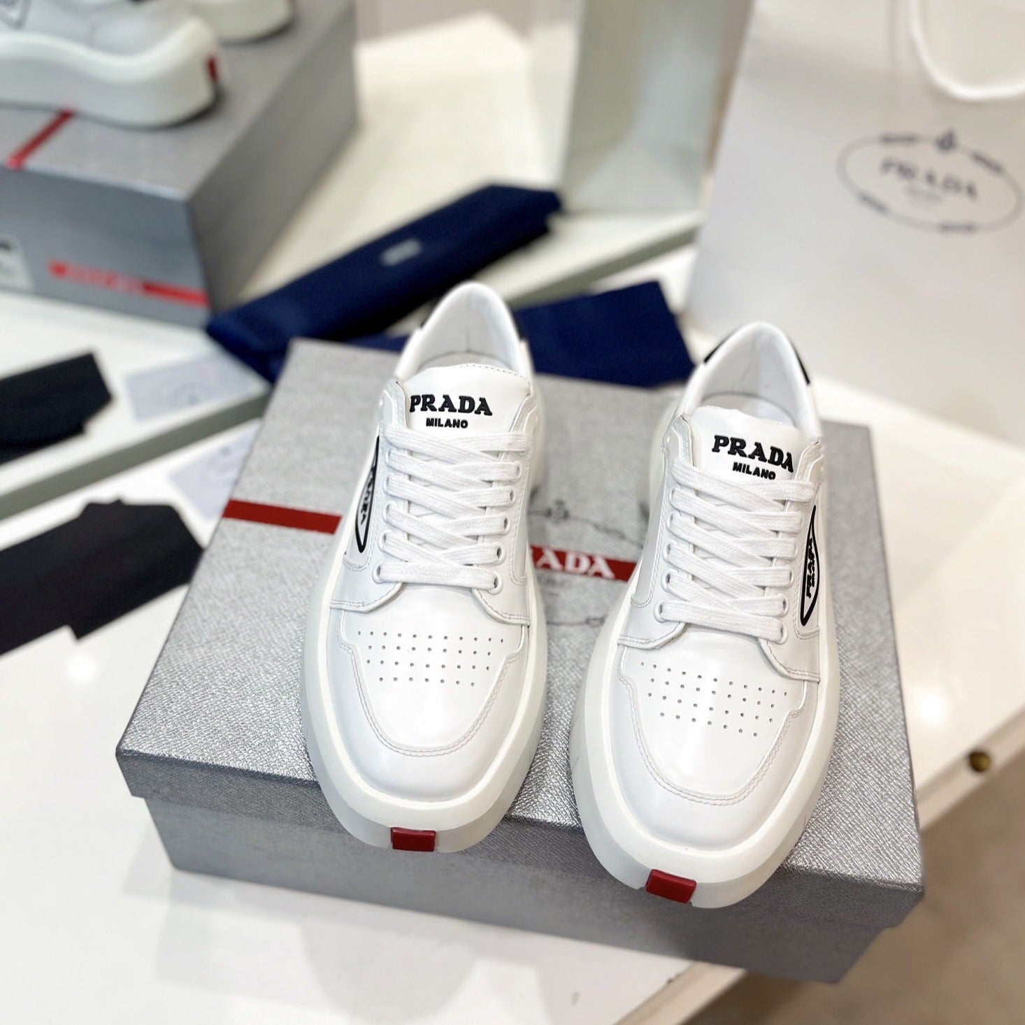 PRADA DOWNTOWN THICK-SOLE SNEAKERS WHITE CALFSKIN