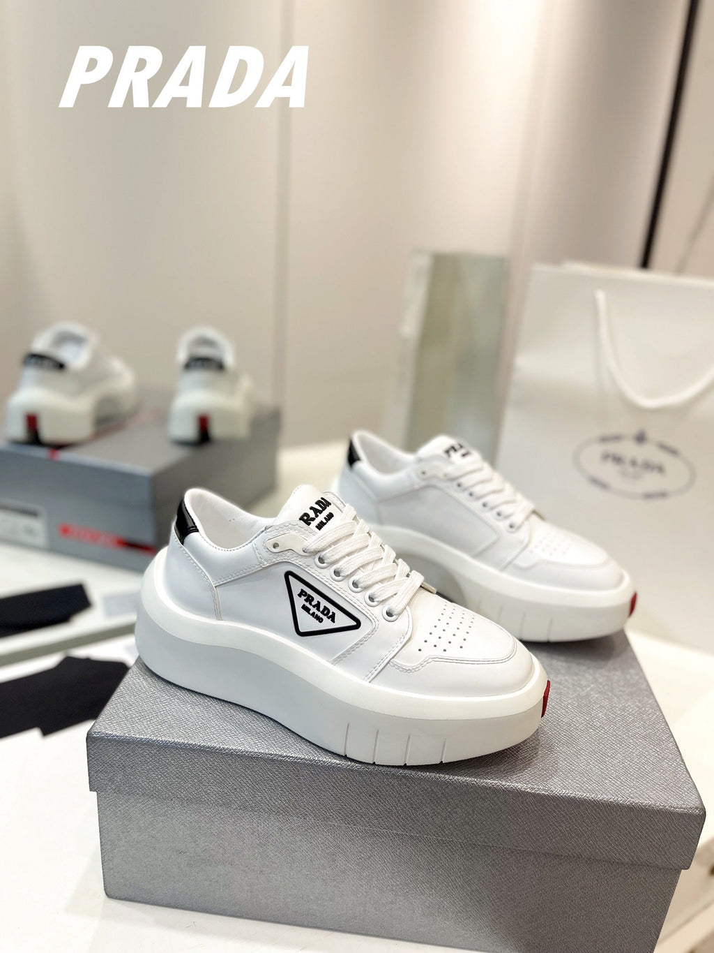 PRADA DOWNTOWN THICK-SOLE SNEAKERS WHITE CALFSKIN