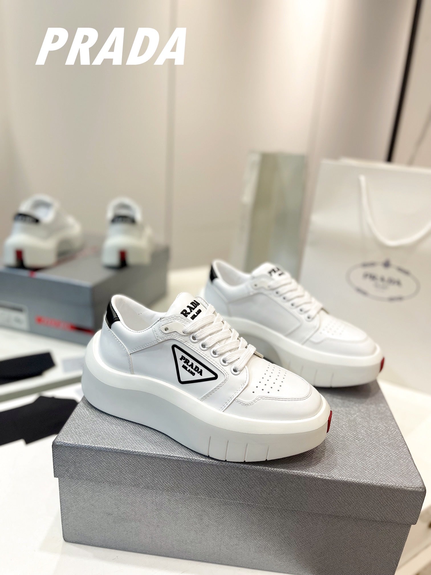 PRADA DOWNTOWN THICK-SOLE SNEAKERS WHITE CALFSKIN