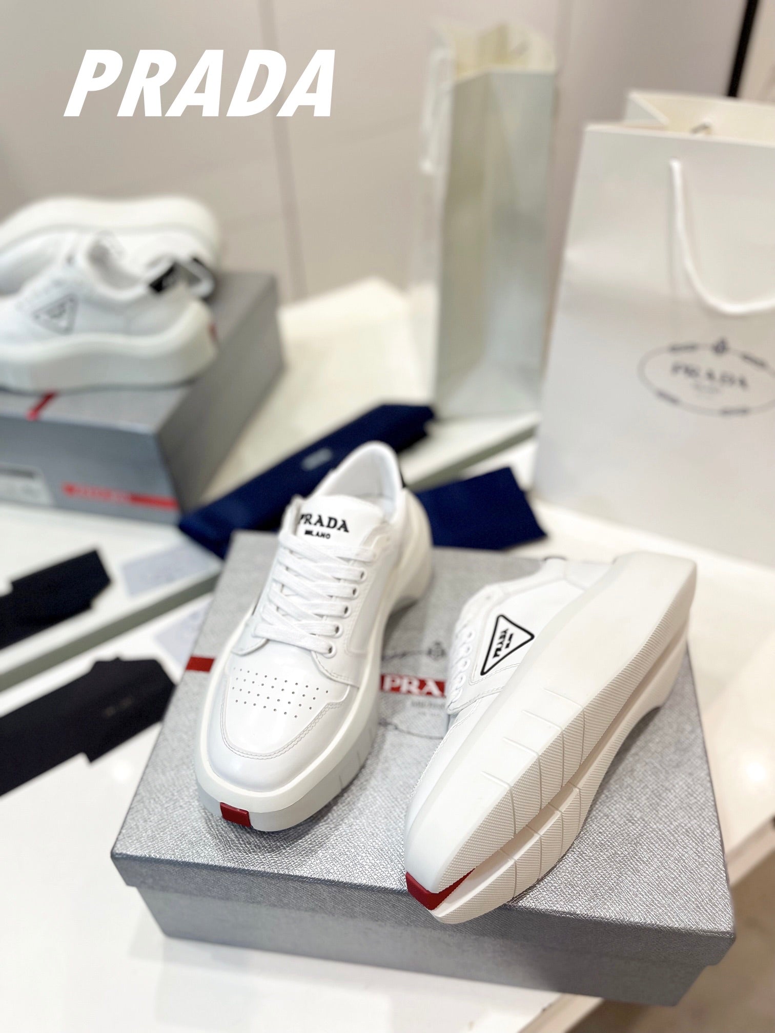 PRADA DOWNTOWN THICK-SOLE SNEAKERS WHITE CALFSKIN