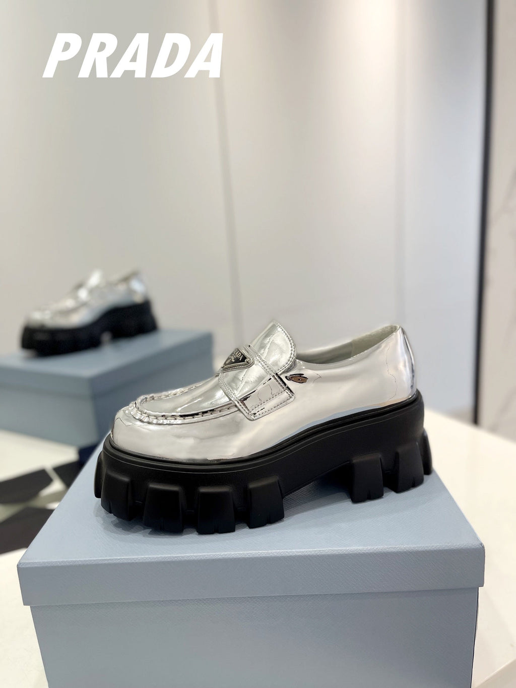 PRADA BRUSHED LEATHER MONOLITH LOAFERS SILVER