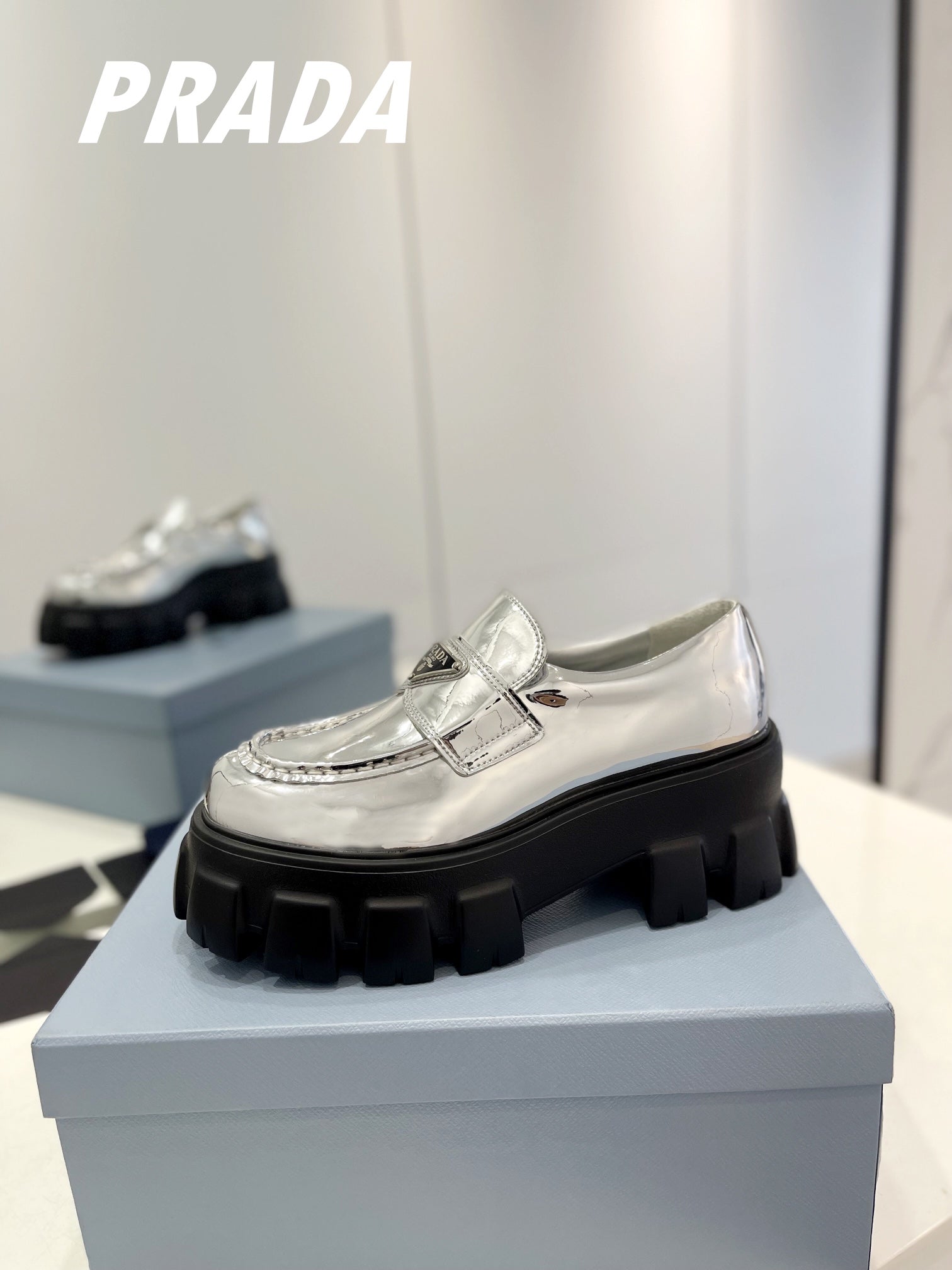 PRADA BRUSHED LEATHER MONOLITH LOAFERS SILVER