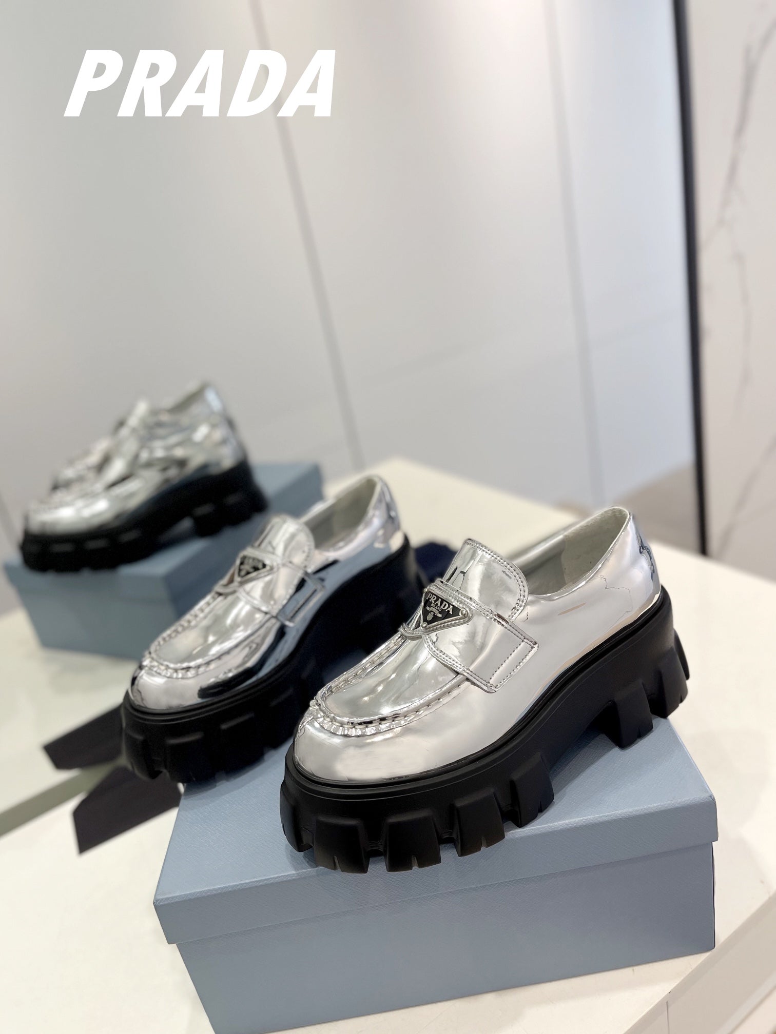 PRADA BRUSHED LEATHER MONOLITH LOAFERS SILVER