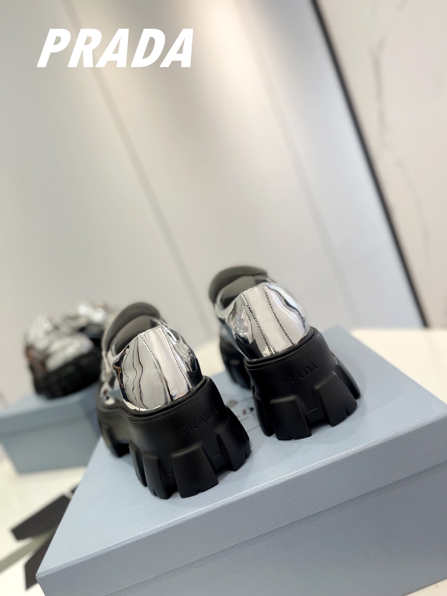 PRADA BRUSHED LEATHER MONOLITH LOAFERS SILVER