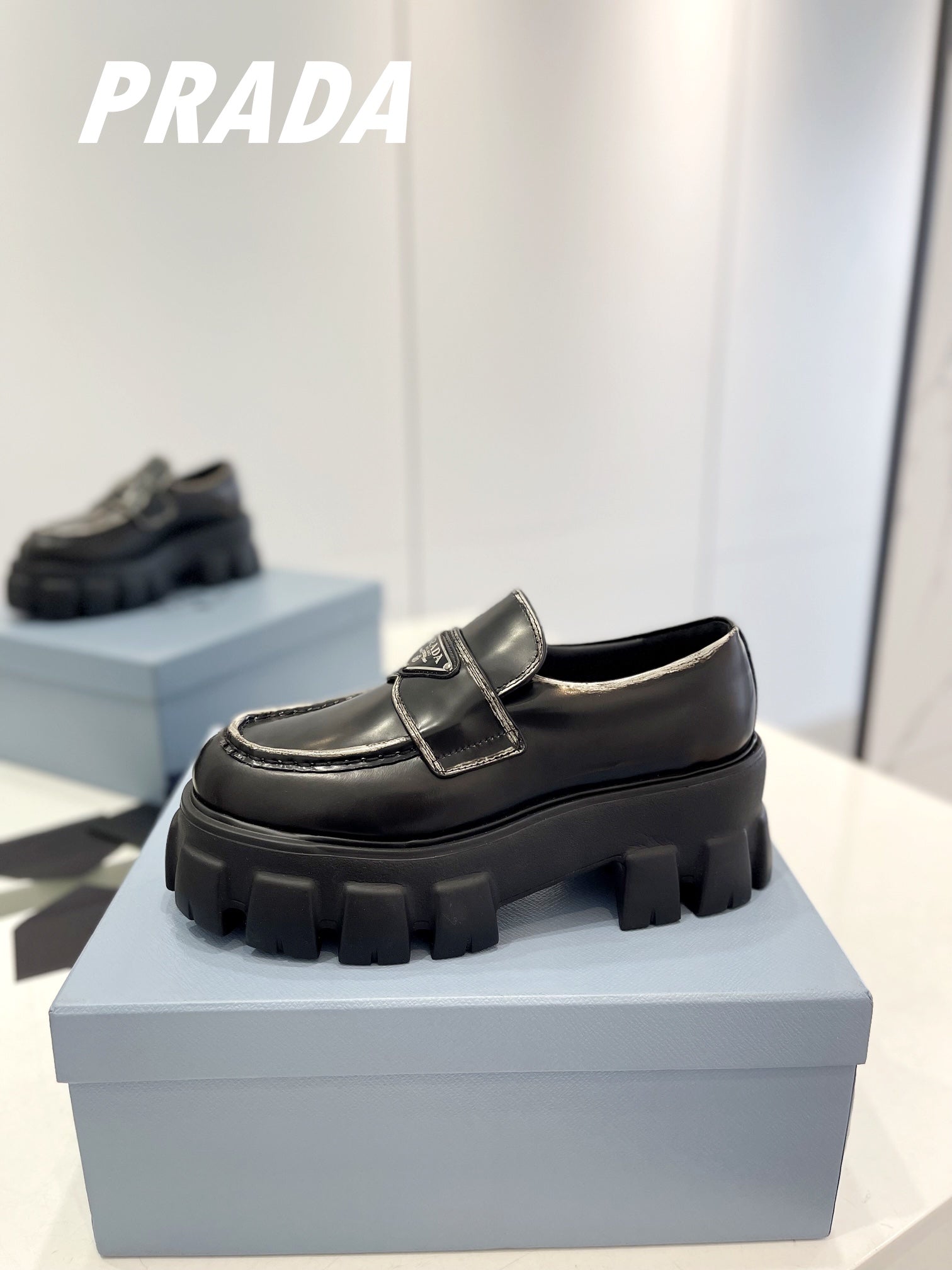 PRADA BRUSHED LEATHER MONOLITH LOAFERS BLACK-SILVER BORDER
