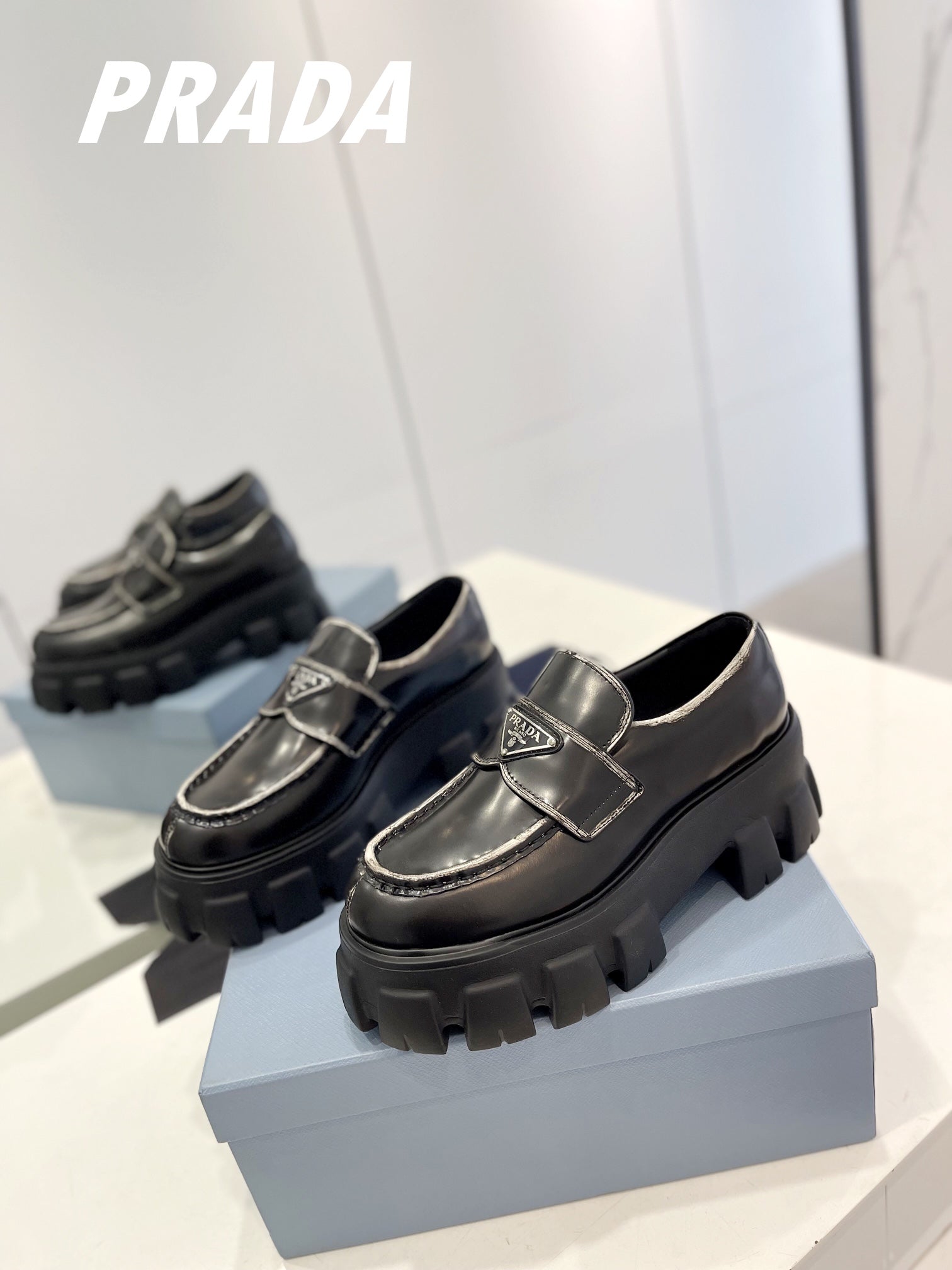 PRADA BRUSHED LEATHER MONOLITH LOAFERS BLACK-SILVER BORDER