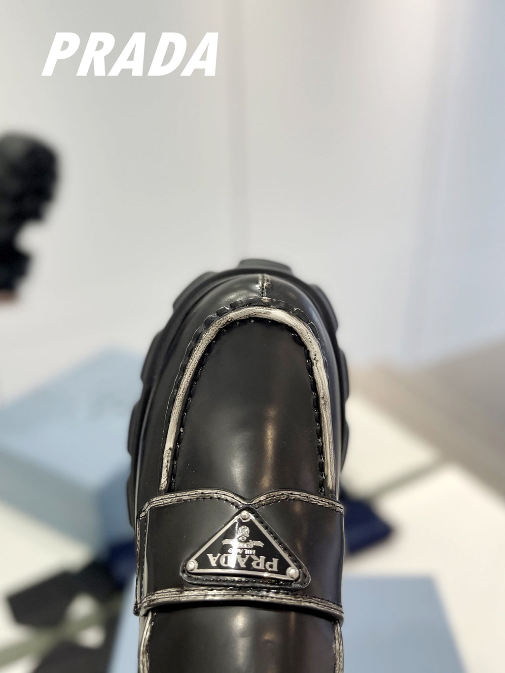 PRADA BRUSHED LEATHER MONOLITH LOAFERS BLACK-SILVER BORDER