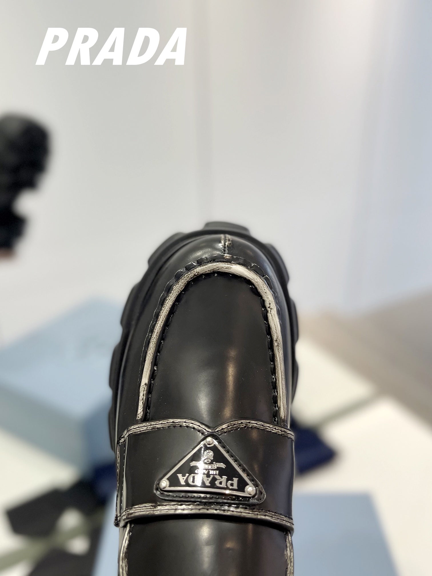 PRADA BRUSHED LEATHER MONOLITH LOAFERS BLACK-SILVER BORDER