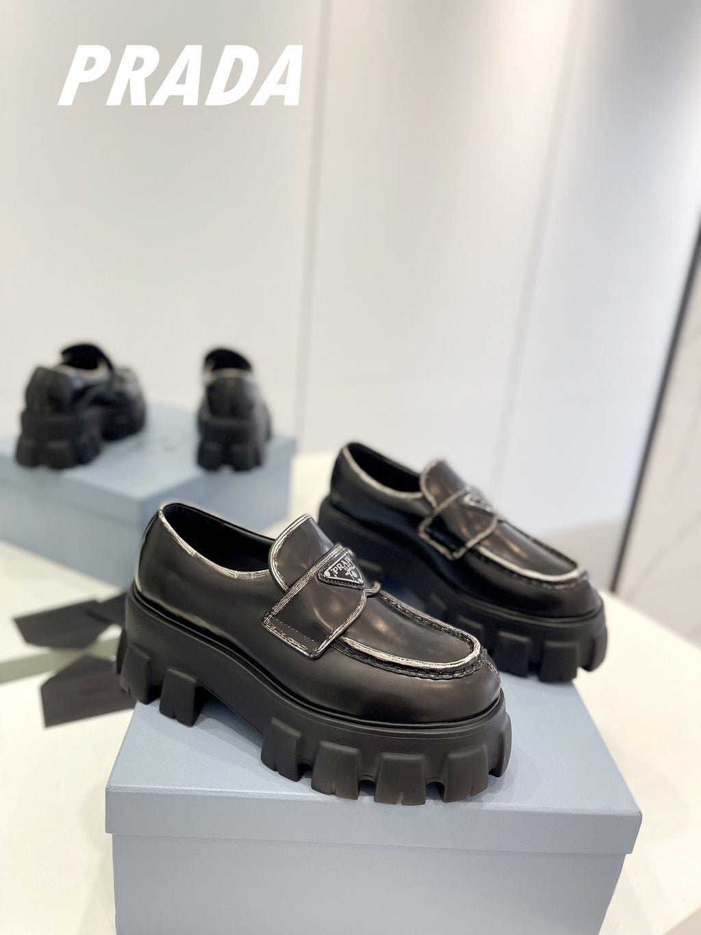 PRADA BRUSHED LEATHER MONOLITH LOAFERS BLACK-SILVER BORDER
