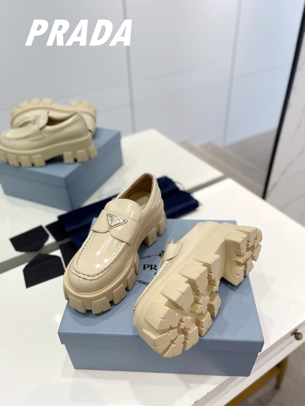 PRADA BRUSHED LEATHER MONOLITH LOAFERS BEIGE