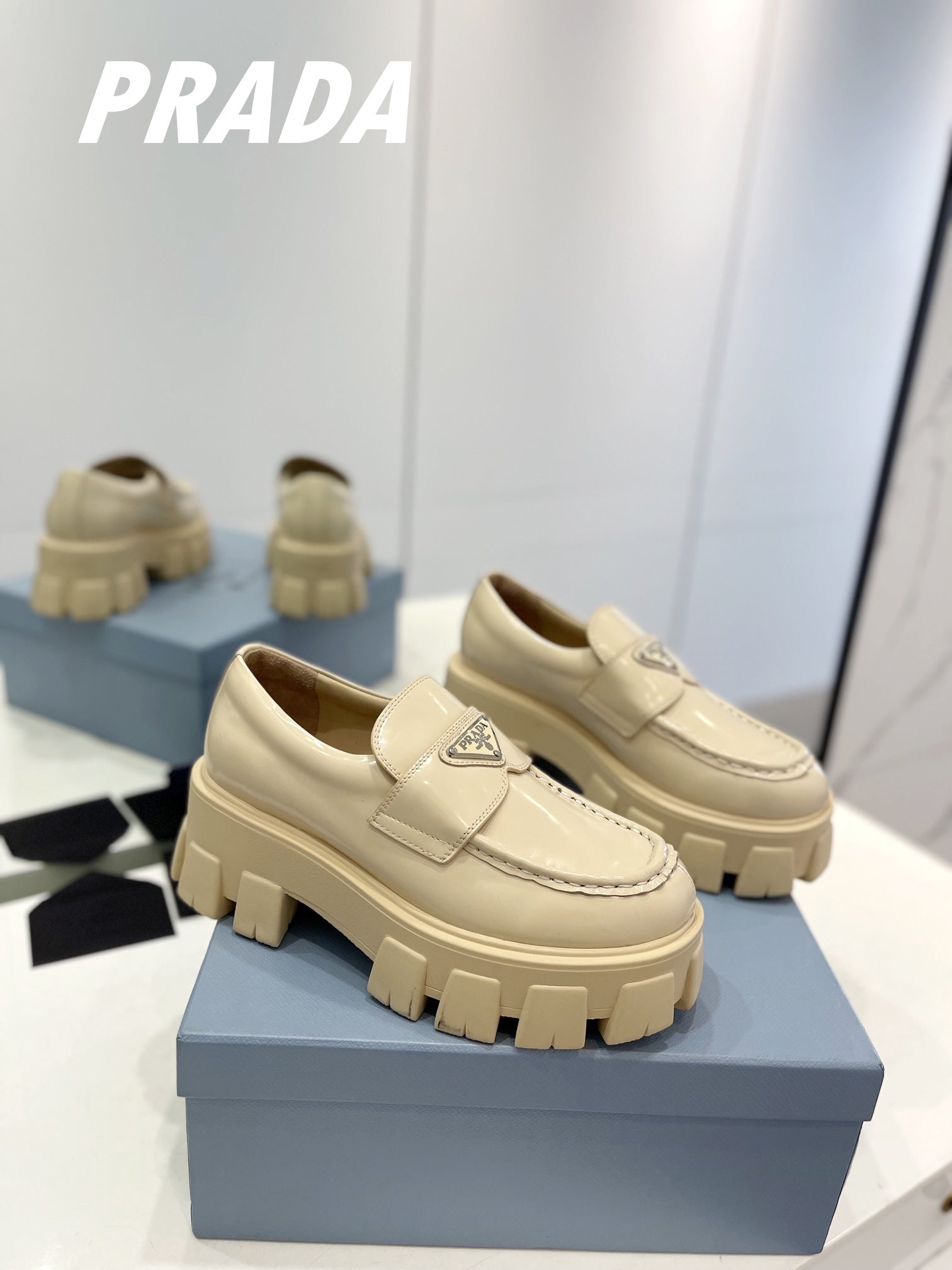 PRADA BRUSHED LEATHER MONOLITH LOAFERS BEIGE