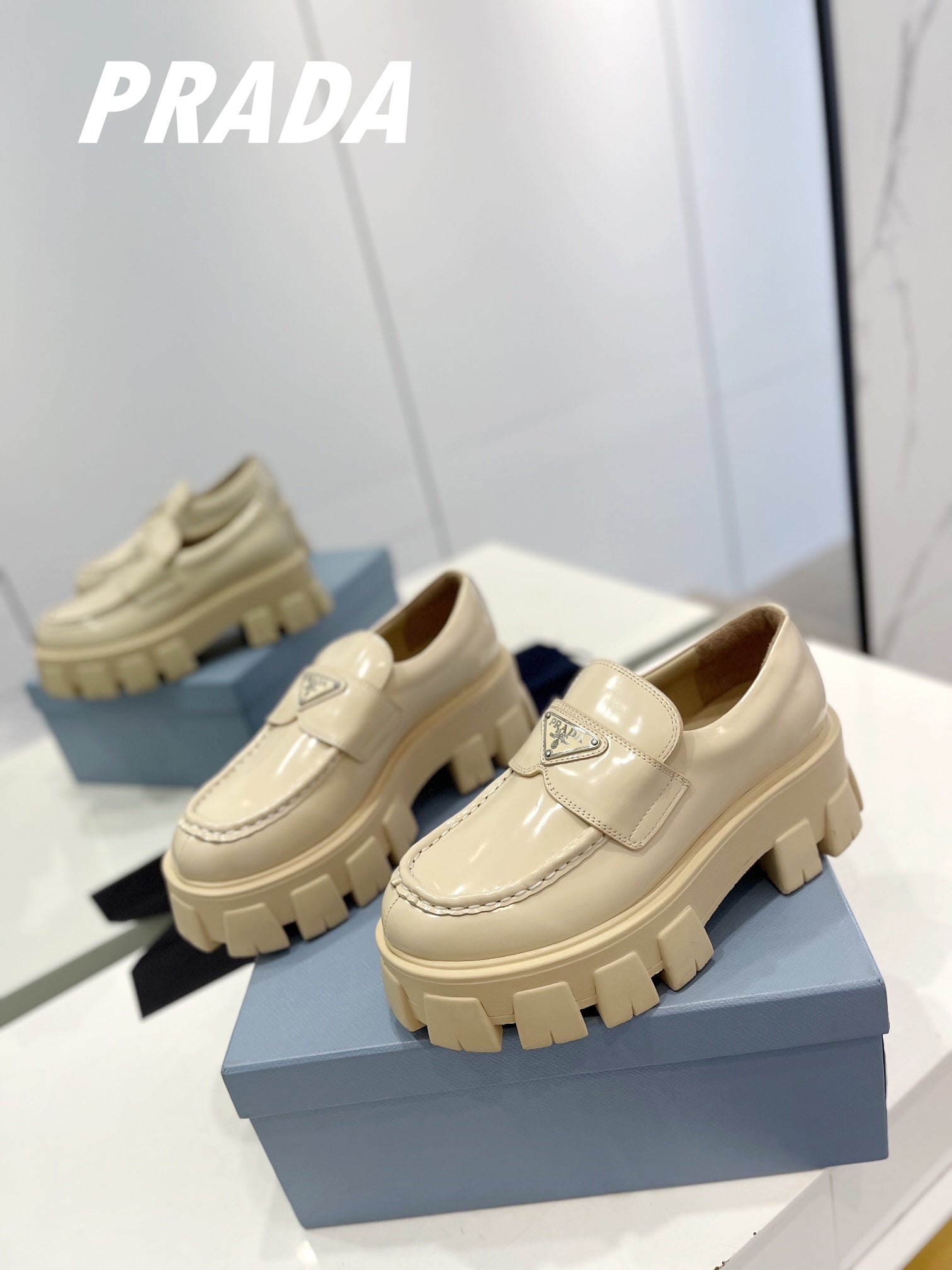 PRADA BRUSHED LEATHER MONOLITH LOAFERS BEIGE