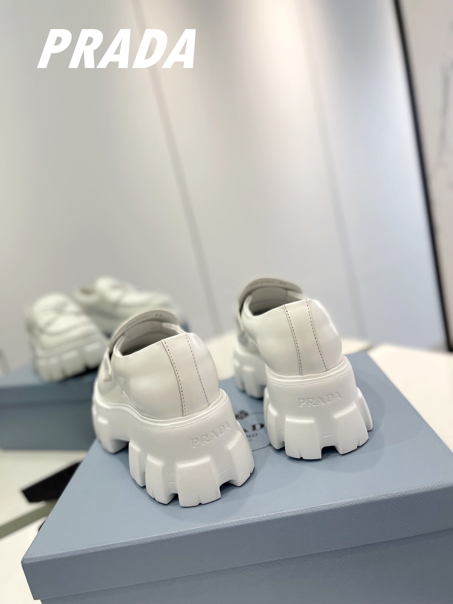 PRADA BRUSHED LEATHER MONOLITH LOAFERS WHITE