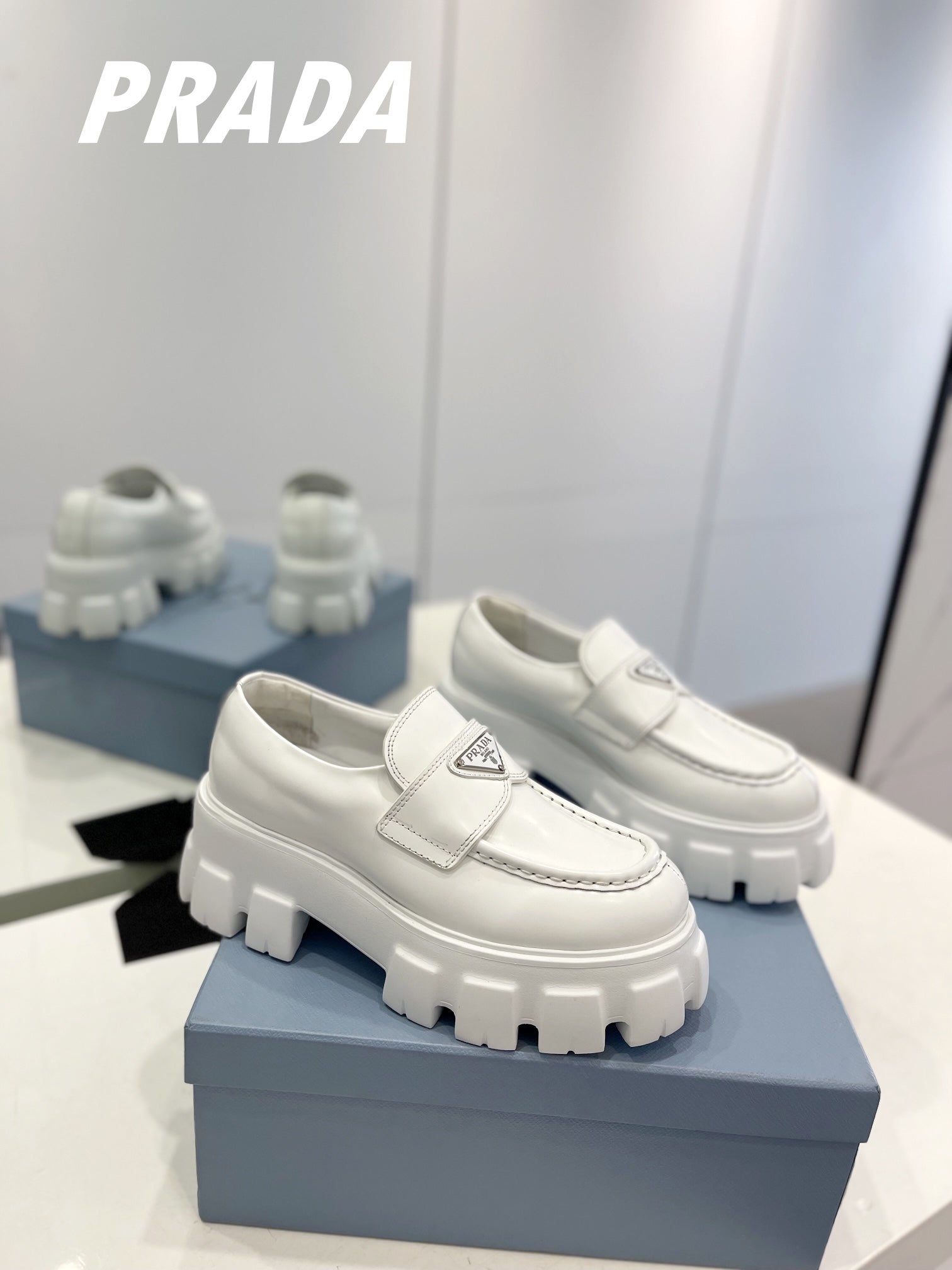 PRADA BRUSHED LEATHER MONOLITH LOAFERS WHITE