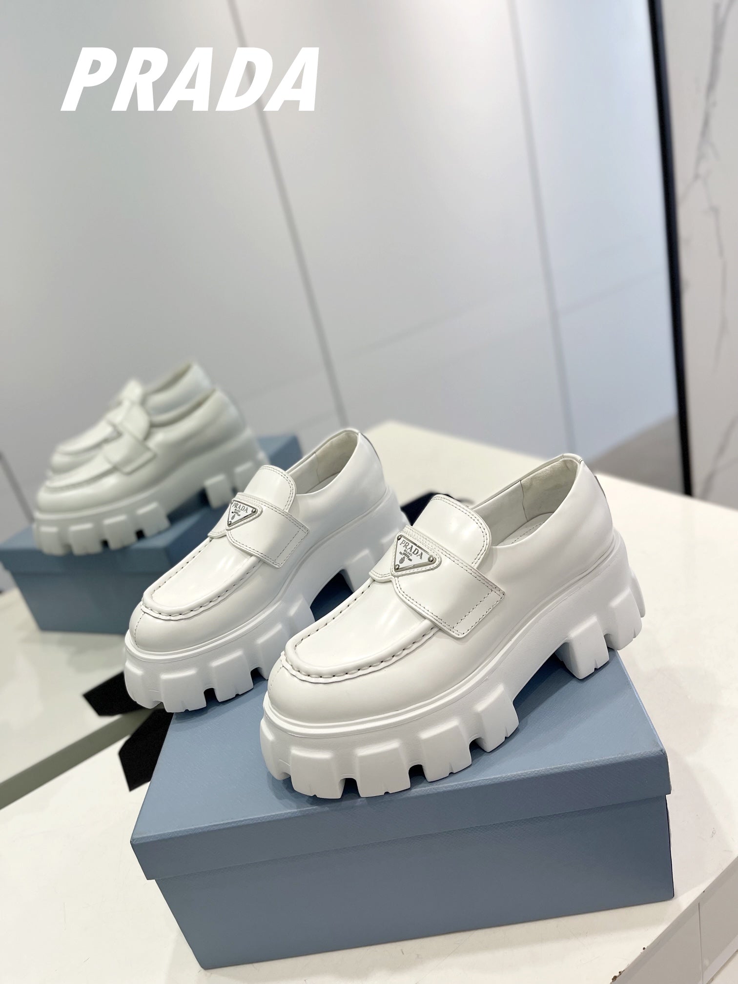 PRADA BRUSHED LEATHER MONOLITH LOAFERS WHITE