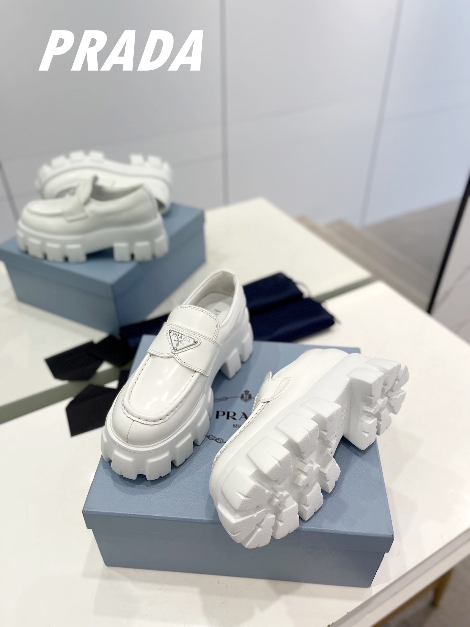 PRADA BRUSHED LEATHER MONOLITH LOAFERS WHITE
