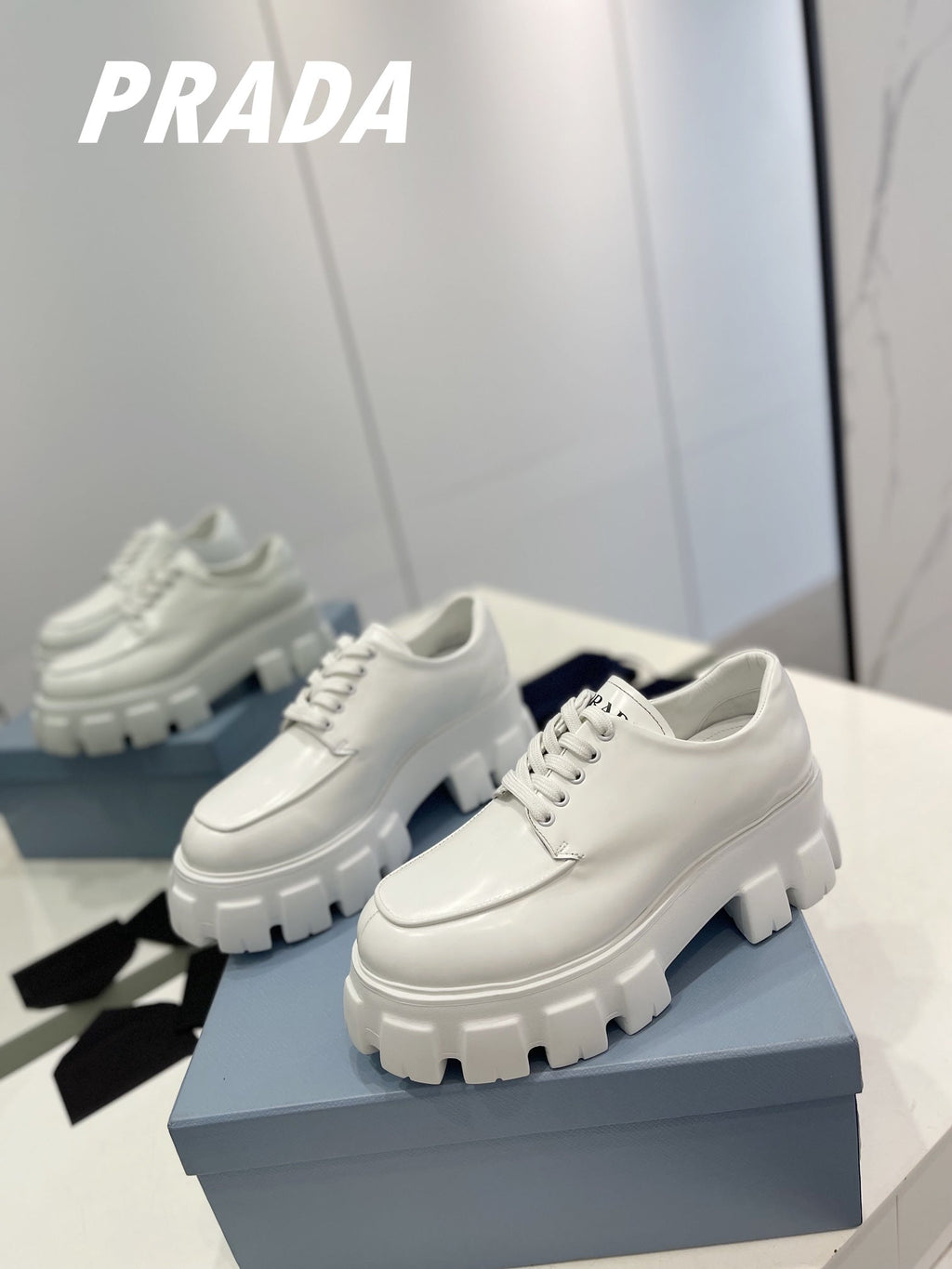 PRADA BRUSHED LEATHER MONOLITH LACE-UP LOAFERS WHITE