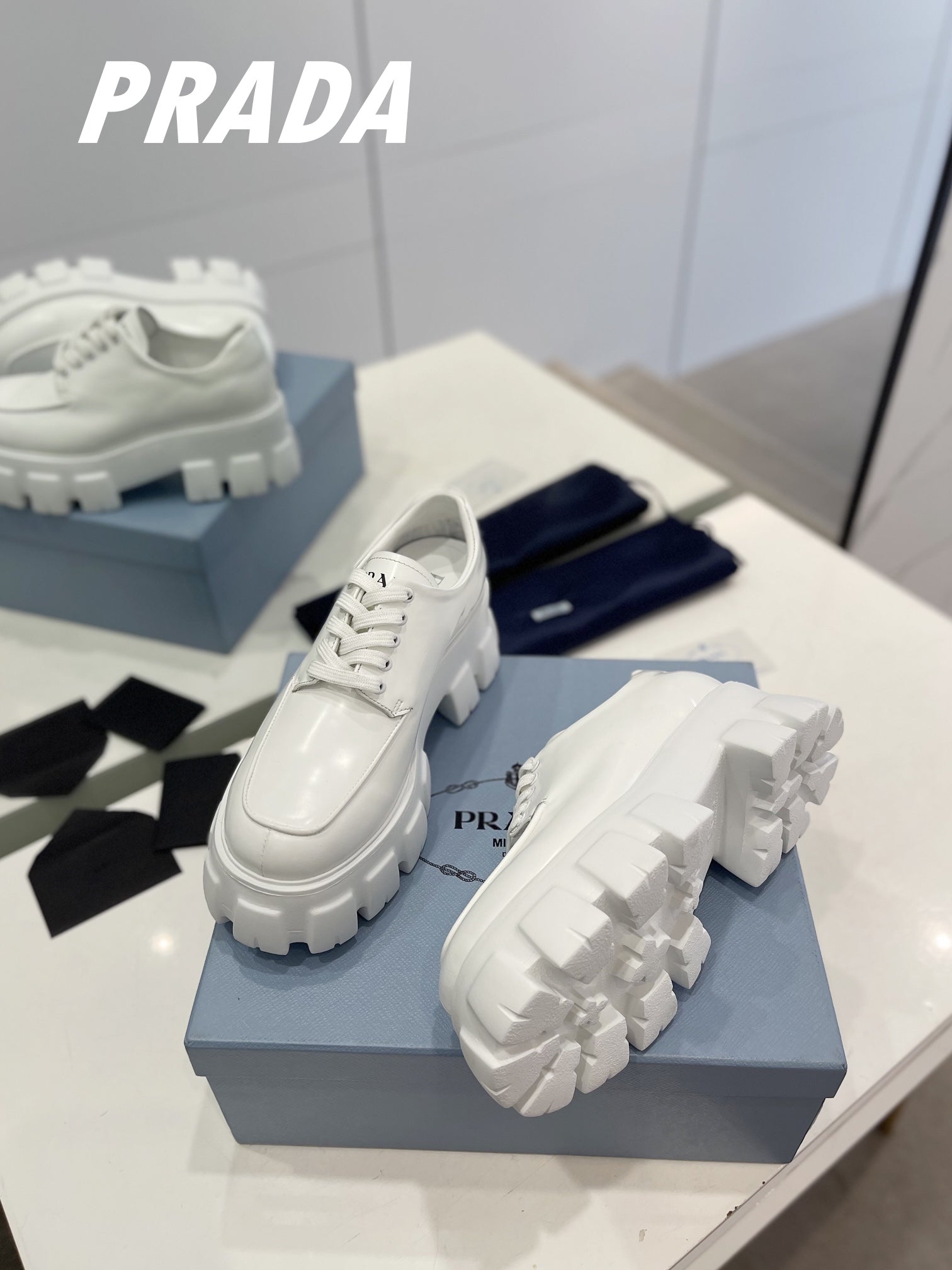 PRADA BRUSHED LEATHER MONOLITH LACE-UP LOAFERS WHITE