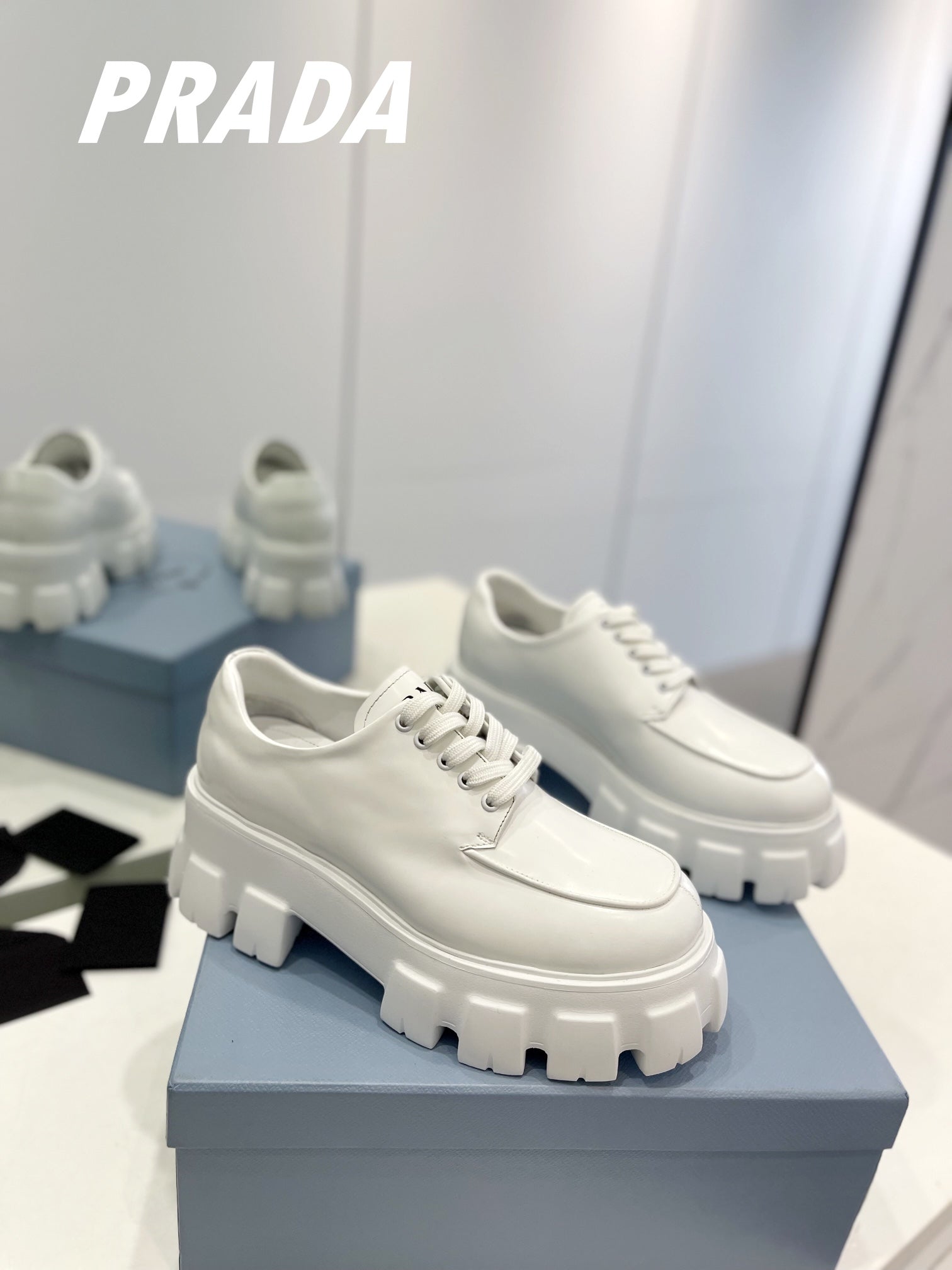 PRADA BRUSHED LEATHER MONOLITH LACE-UP LOAFERS WHITE