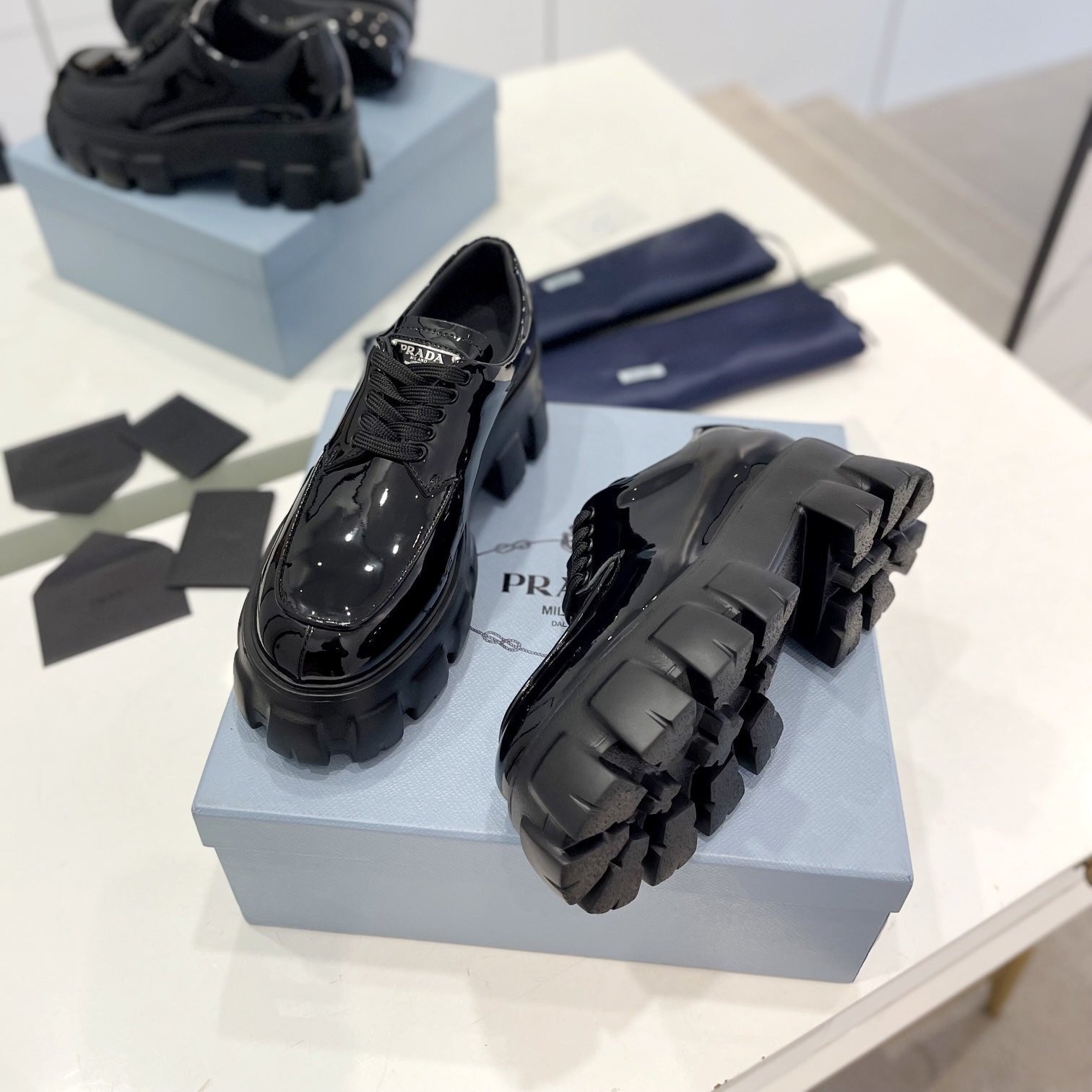 PRADA MONOLITH LACE-UP LOAFER IN BLACK GLOSSY CALFSKIN ATTACHED TRIANGLE LOGO