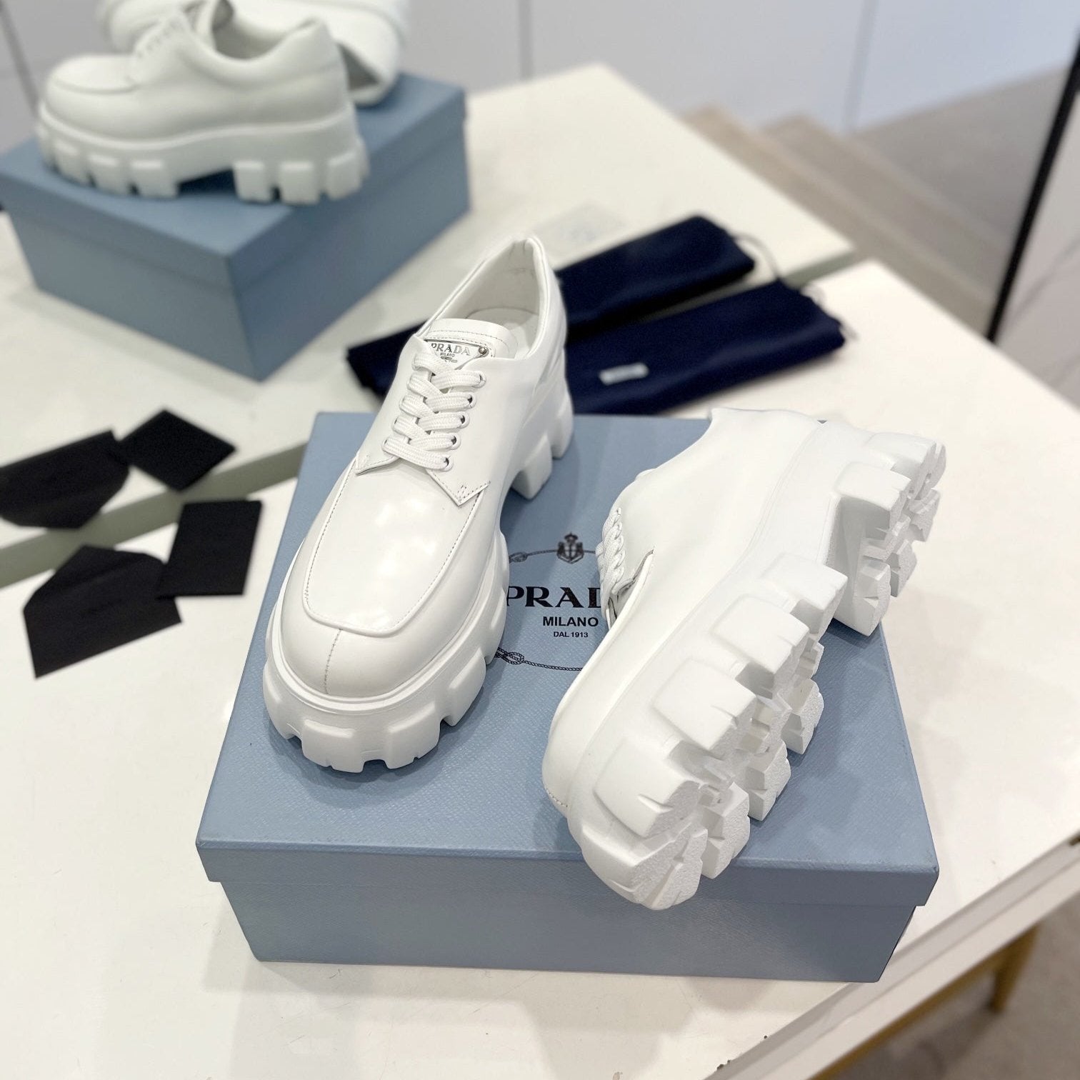 PRADA MONOLITH LACE-UP LOAFER IN WHITE CALFSKIN ATTACHED TRIANGLE LOGO