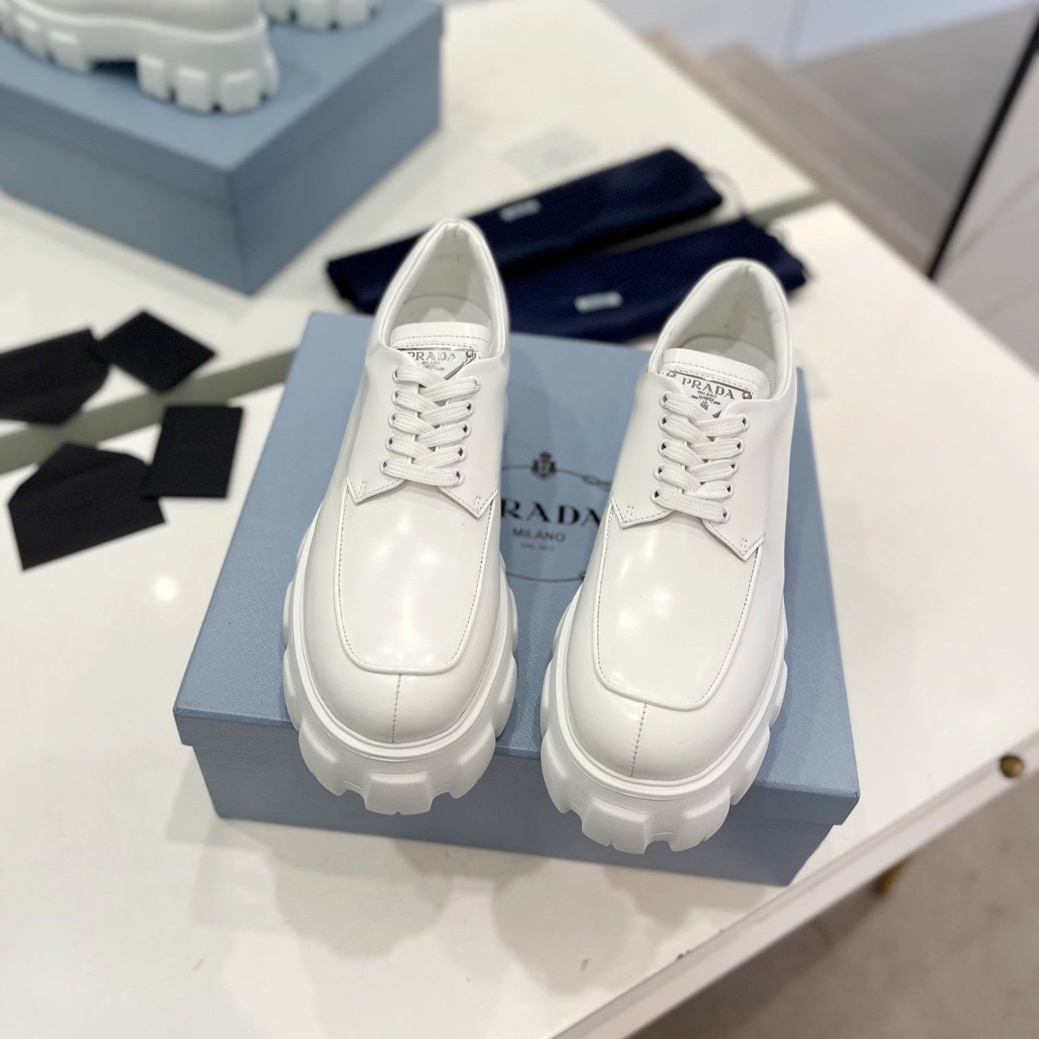 PRADA MONOLITH LACE-UP LOAFER IN WHITE CALFSKIN ATTACHED TRIANGLE LOGO