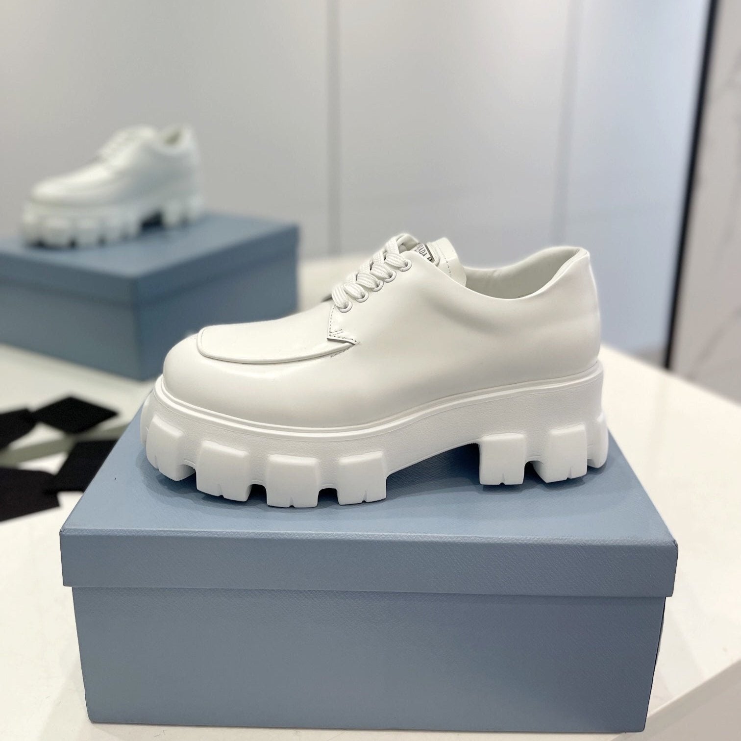 PRADA MONOLITH LACE-UP LOAFER IN WHITE CALFSKIN ATTACHED TRIANGLE LOGO
