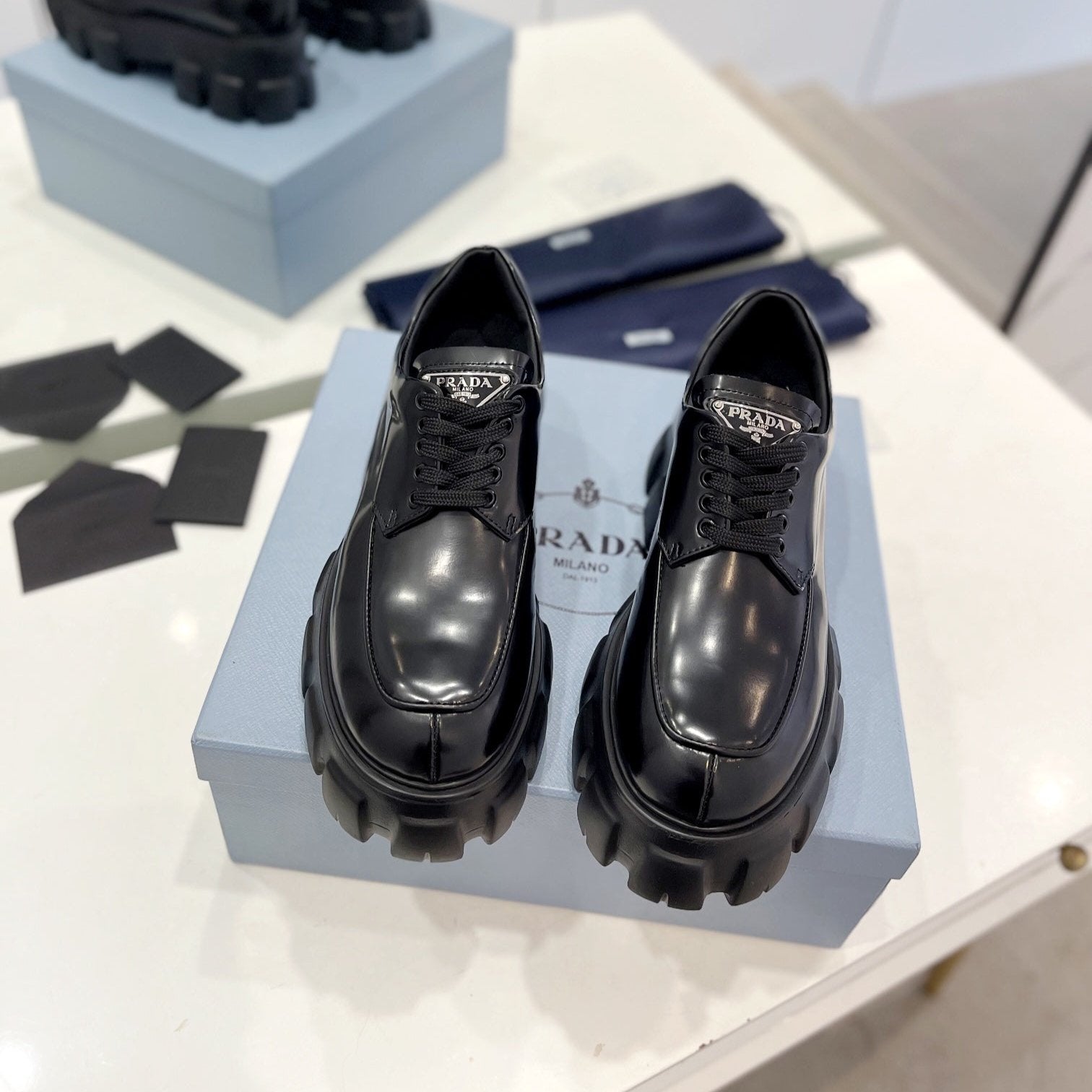 PRADA MONOLITH LACE-UP LOAFER IN BLACK CALFSKIN ATTACHED TRIANGLE LOGO