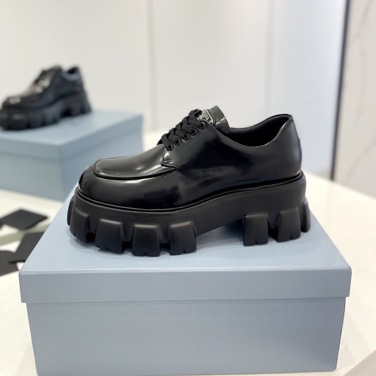 PRADA MONOLITH LACE-UP LOAFER IN BLACK CALFSKIN ATTACHED TRIANGLE LOGO