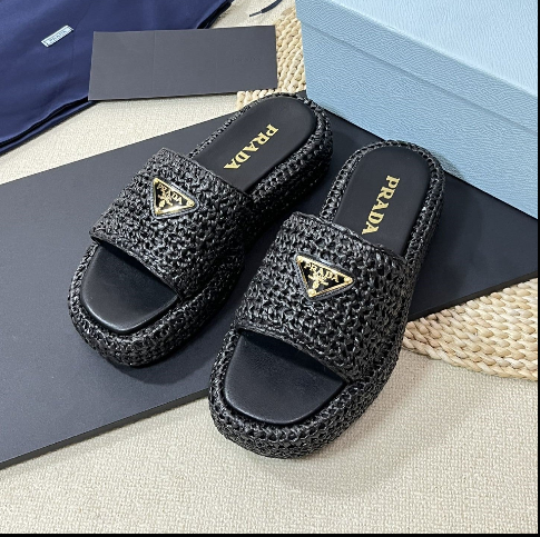 PRADA PLATFORM SLIDES IN BLACK WOVEN RAFFIA