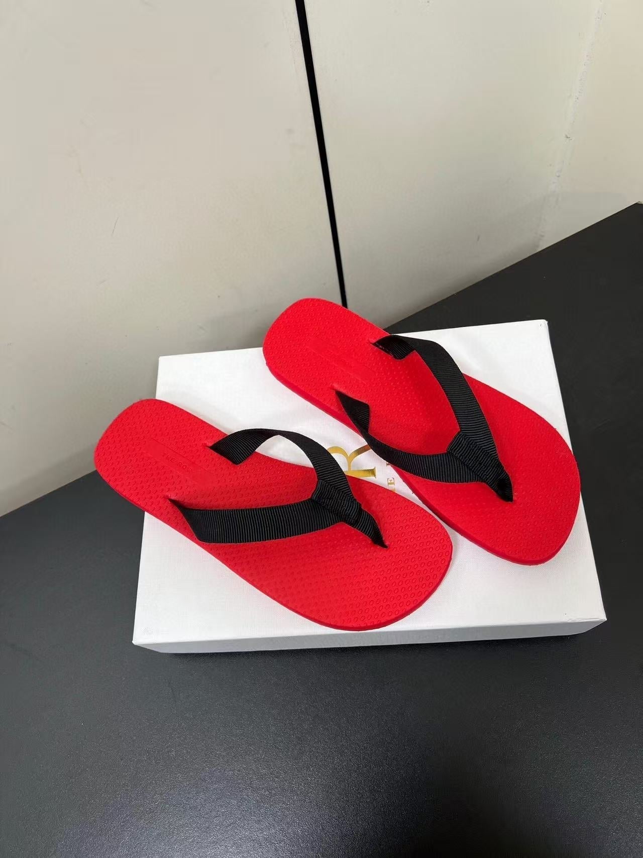 PRADA THE ROW THICK-SOLED FLIP FLOPS IN RED RUBBER