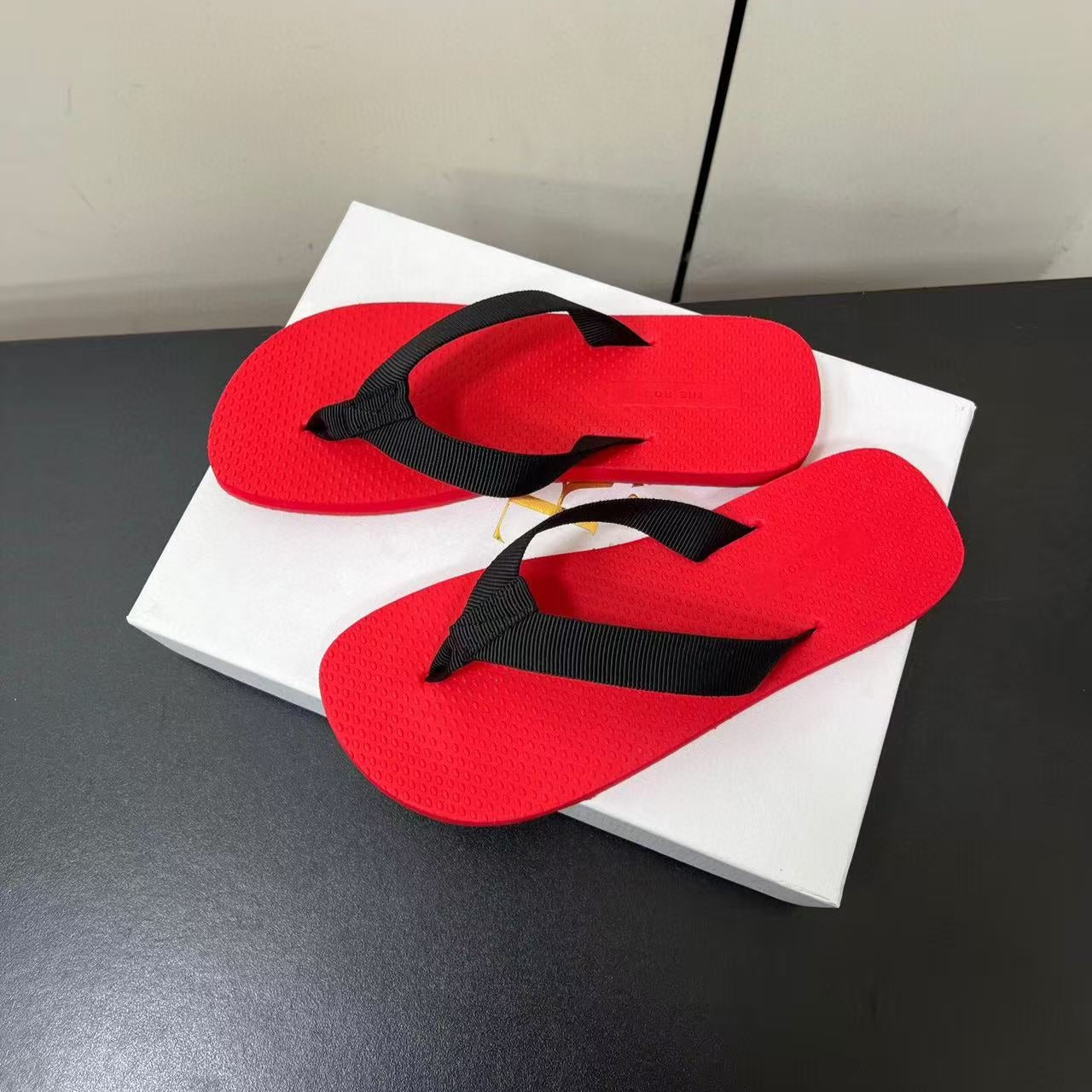 PRADA THE ROW THICK-SOLED FLIP FLOPS IN RED RUBBER