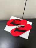 PRADA THE ROW THICK-SOLED FLIP FLOPS IN RED RUBBER