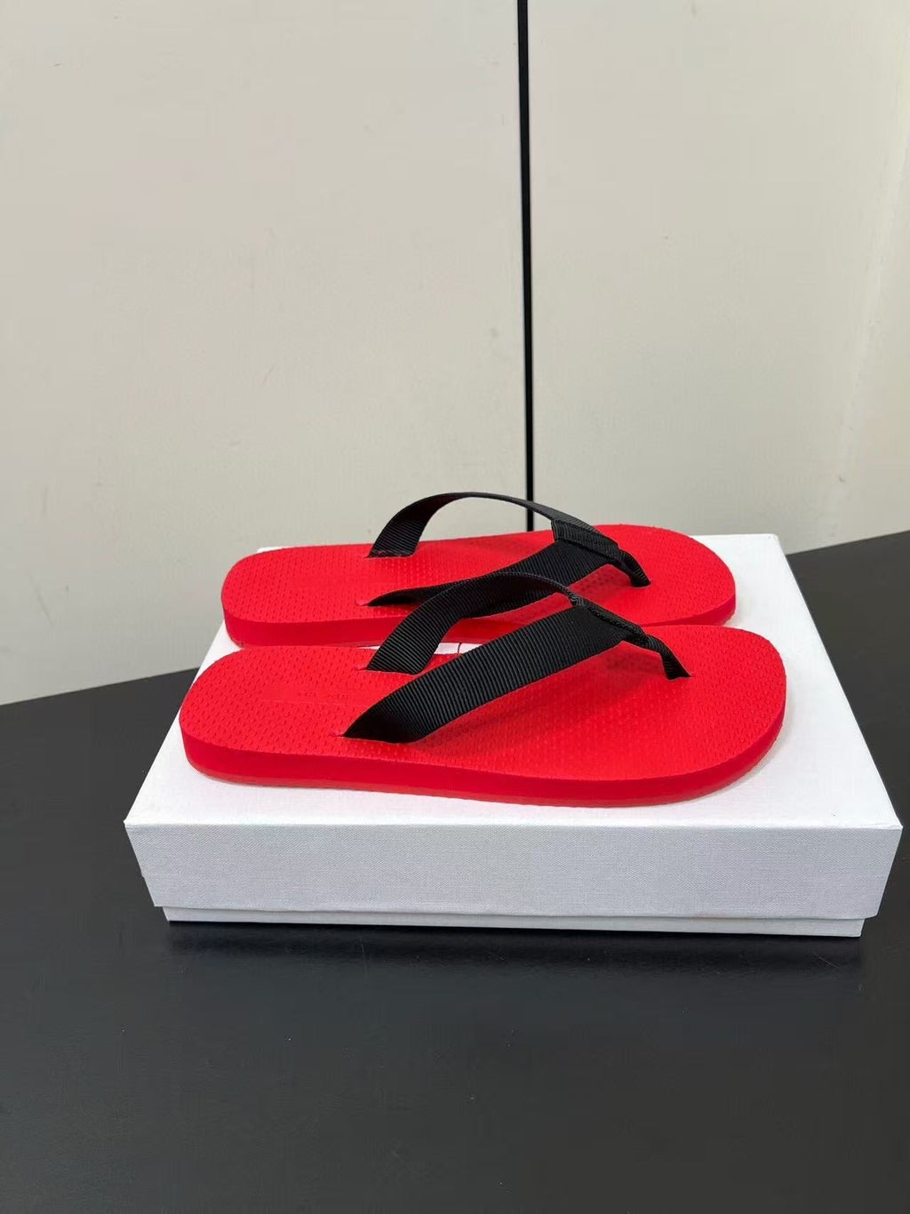 PRADA THE ROW THICK-SOLED FLIP FLOPS IN RED RUBBER