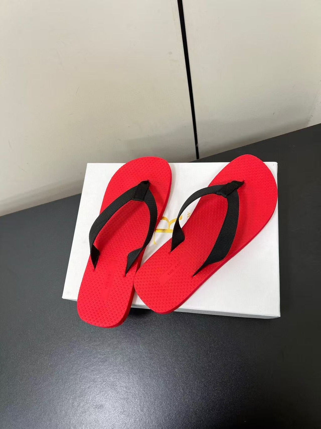 PRADA THE ROW THICK-SOLED FLIP FLOPS IN RED RUBBER