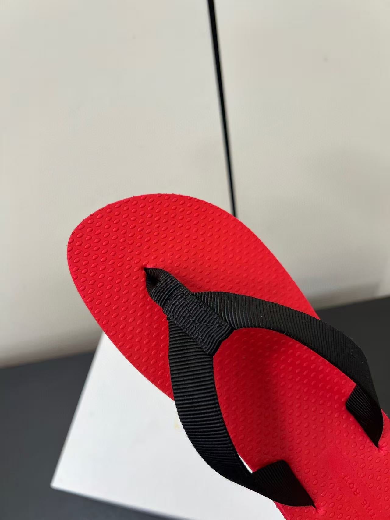PRADA THE ROW THICK-SOLED FLIP FLOPS IN RED RUBBER