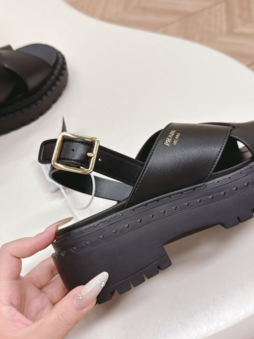 PRADA 25S CRISSCROSS SANLS IN BLACK CALFSKIN