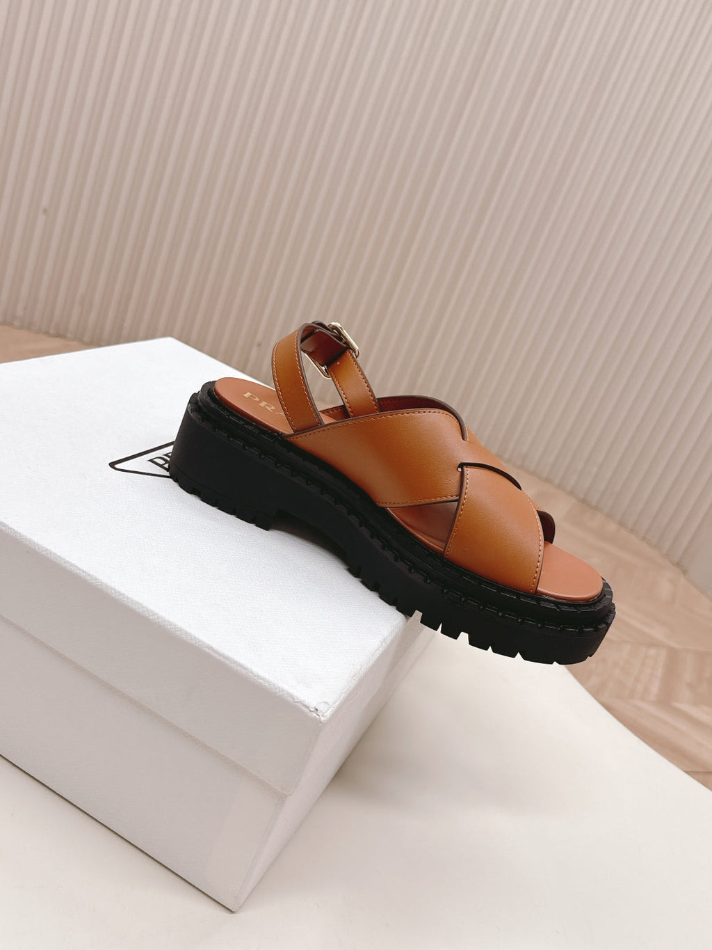 PRADA 25S CRISSCROSS SANLS IN LIGHT TAN CALFSKIN