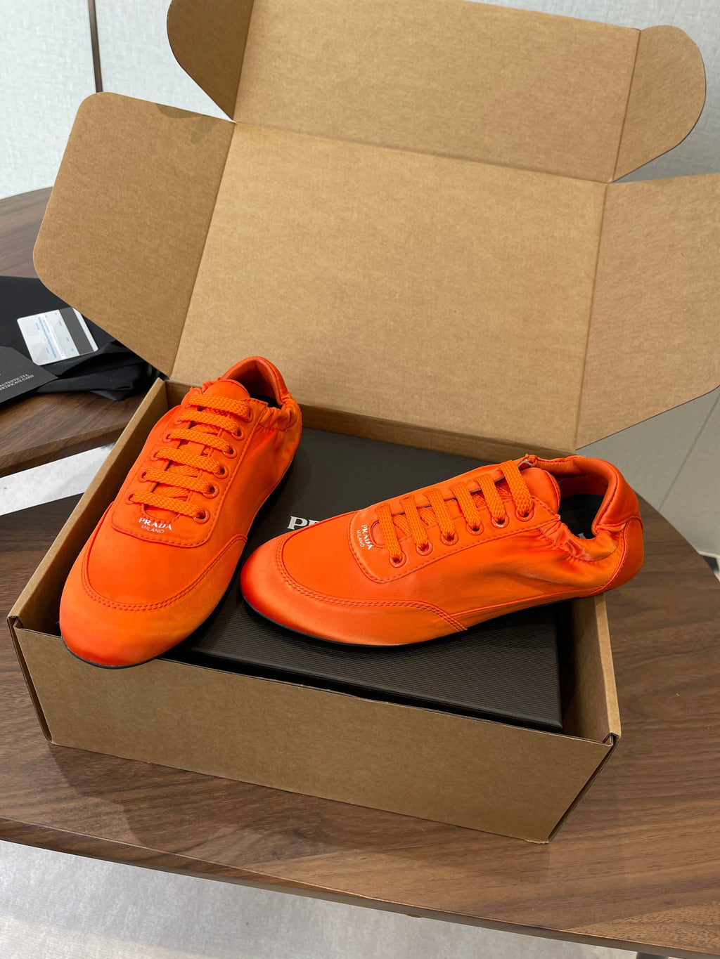 PRADA 25S SNEAKER IN ORANGE SILK