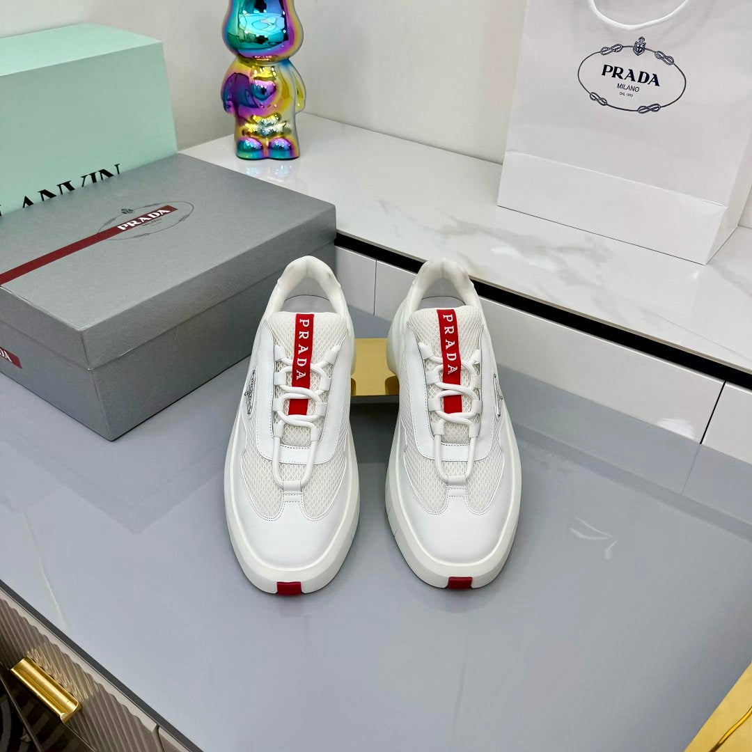 PRADA 25S CROSS LACED SNEAKERS IN WHITE CALFSKIN