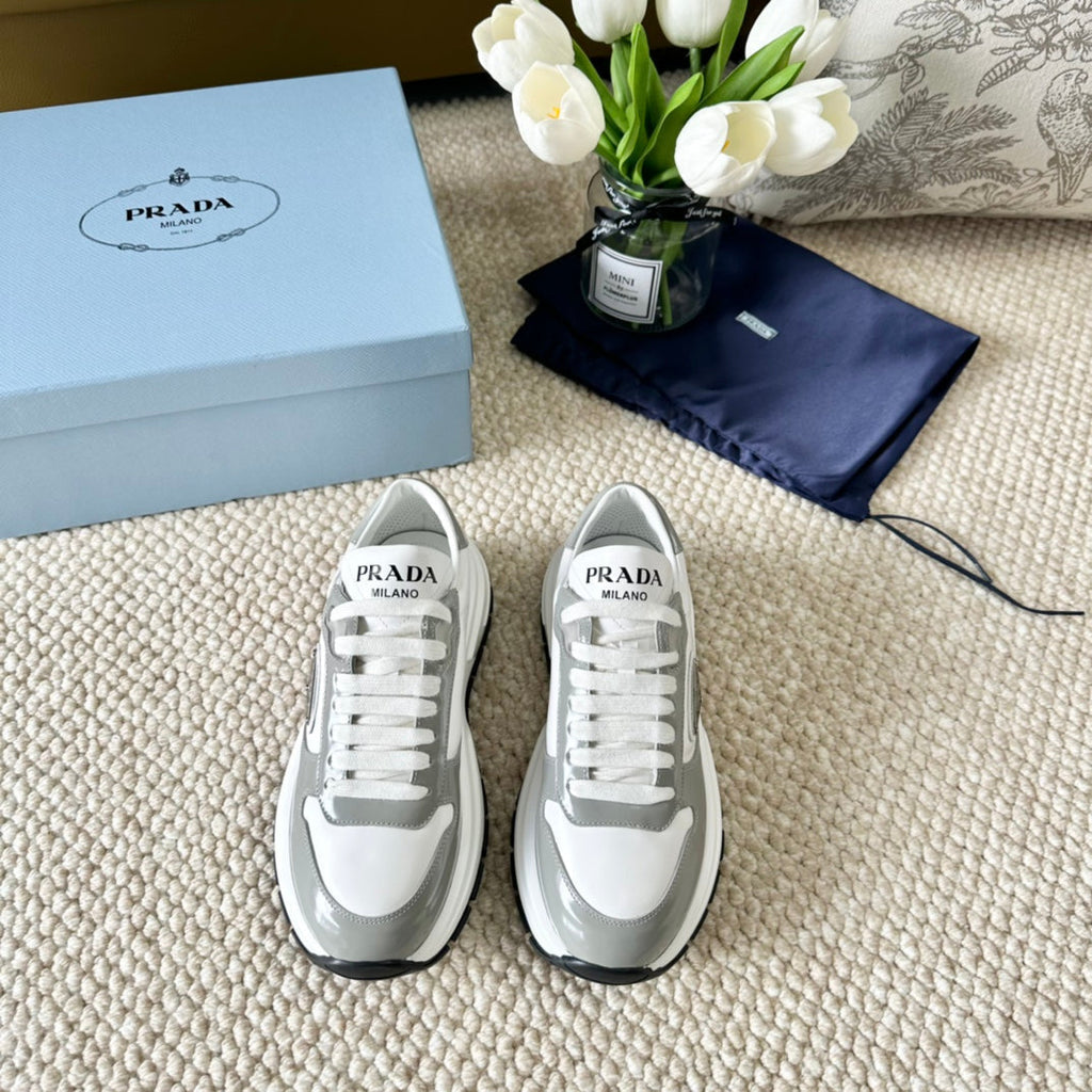 PRADA BLACK THICK SOLE SNEAKER GRAY AND WHITE CALFSKIN