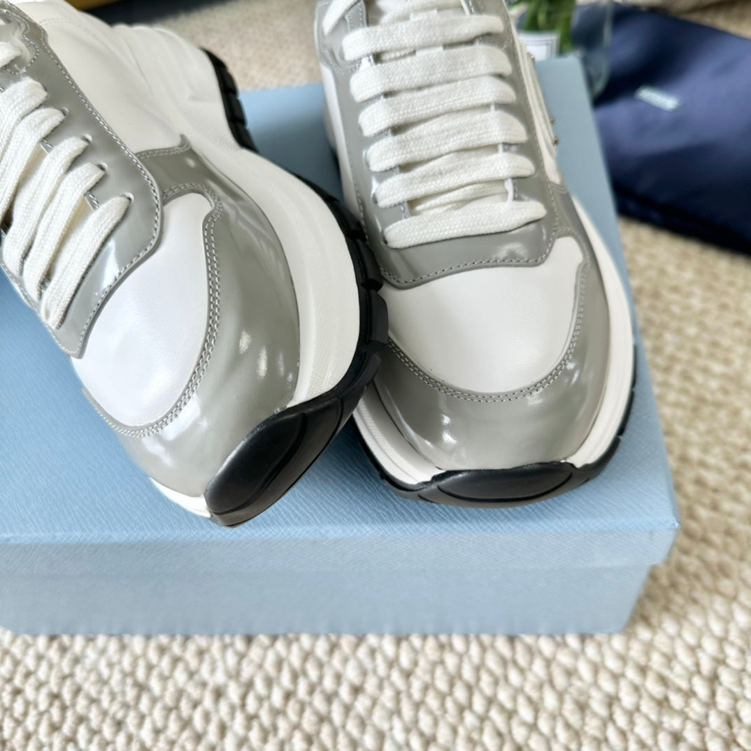 PRADA BLACK THICK SOLE SNEAKER GRAY AND WHITE CALFSKIN