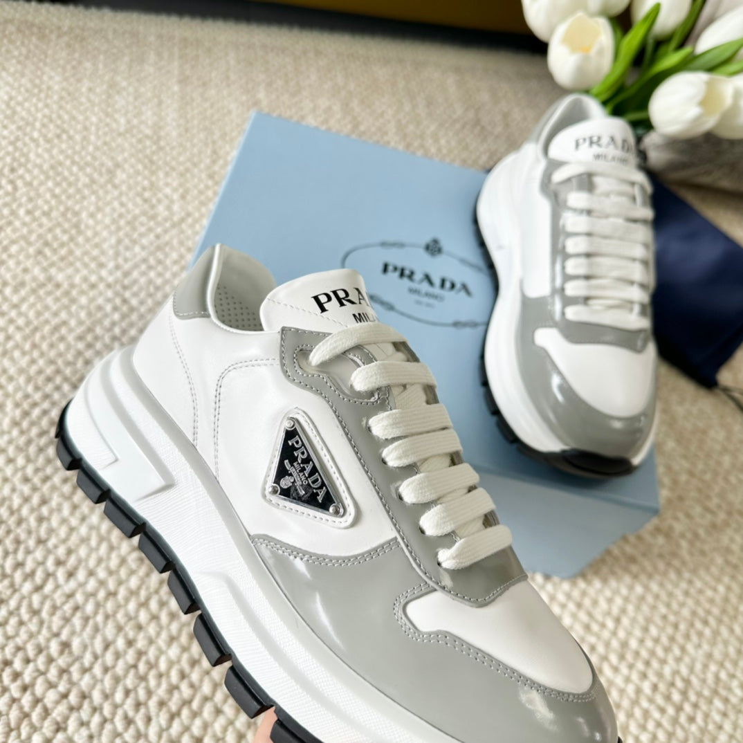 PRADA BLACK THICK SOLE SNEAKER GRAY AND WHITE CALFSKIN