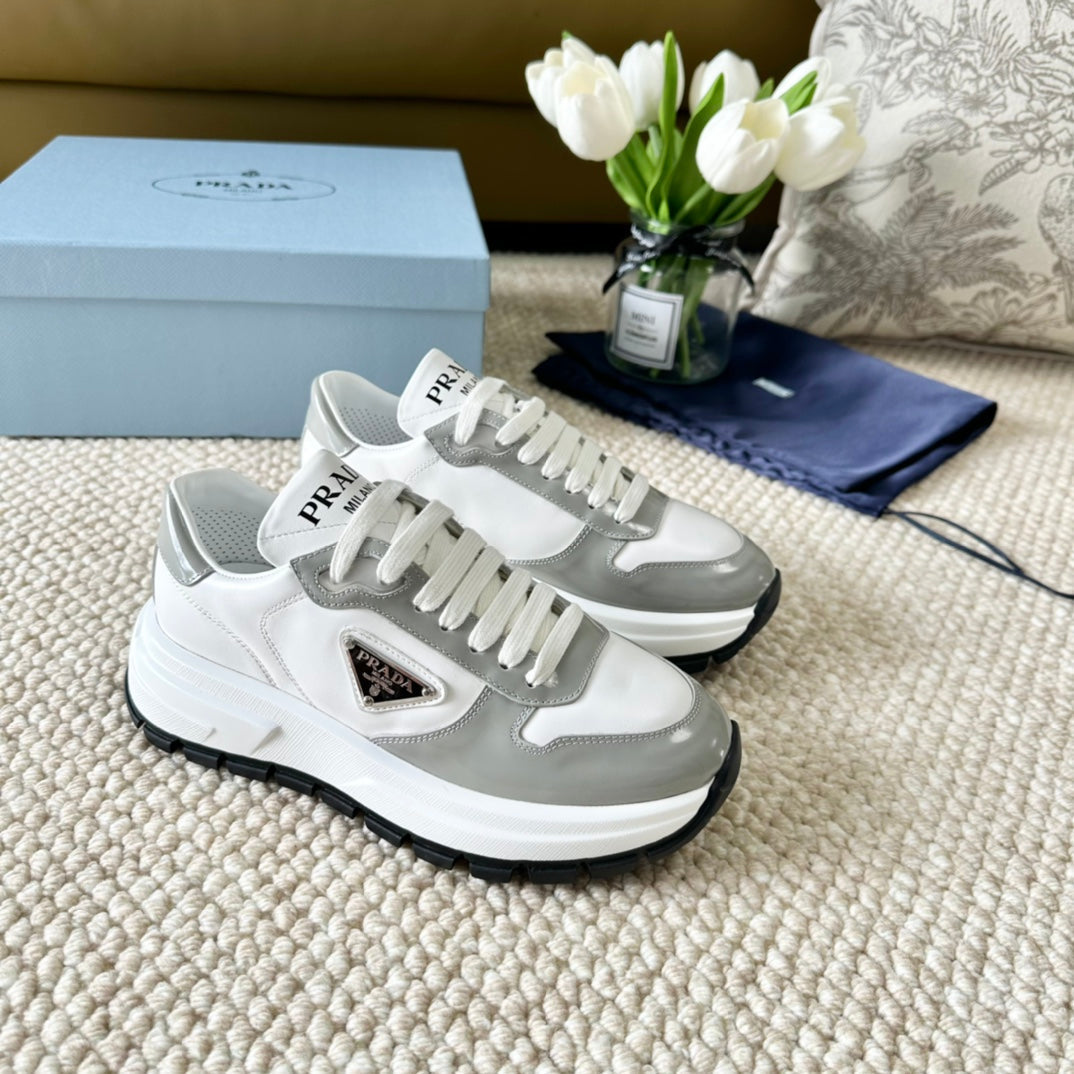 PRADA BLACK THICK SOLE SNEAKER GRAY AND WHITE CALFSKIN