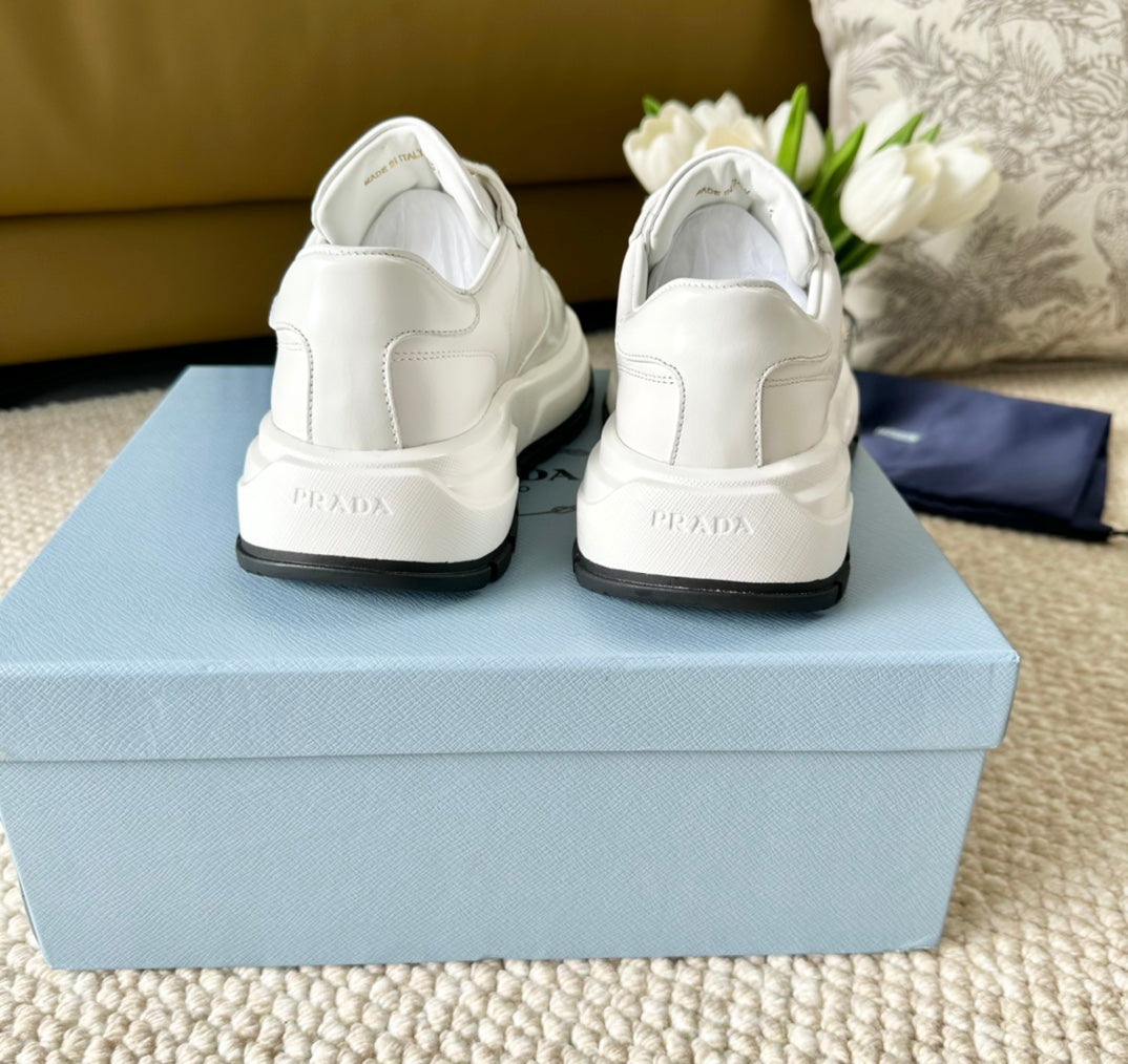 PRADA THICK SOLE SNEAKER WHITE AND BLACK LOGO CALFSKIN