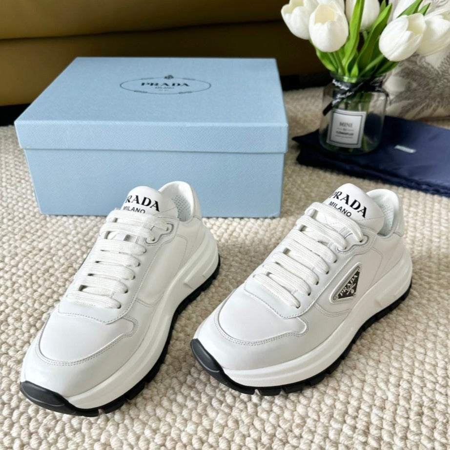 PRADA THICK SOLE SNEAKER WHITE AND BLACK LOGO CALFSKIN