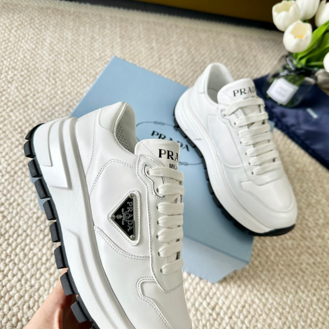 PRADA THICK SOLE SNEAKER WHITE AND BLACK LOGO CALFSKIN