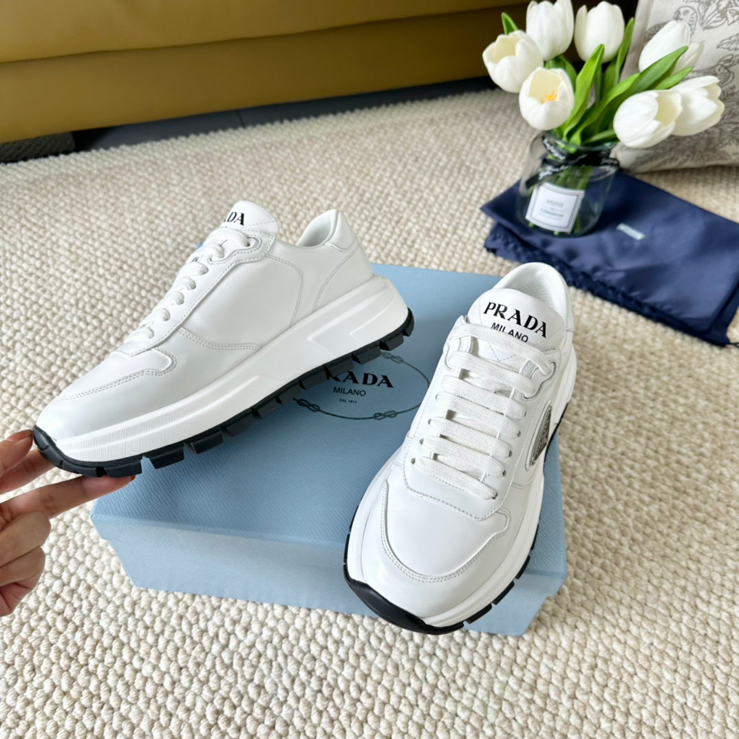 PRADA THICK SOLE SNEAKER WHITE AND BLACK LOGO CALFSKIN