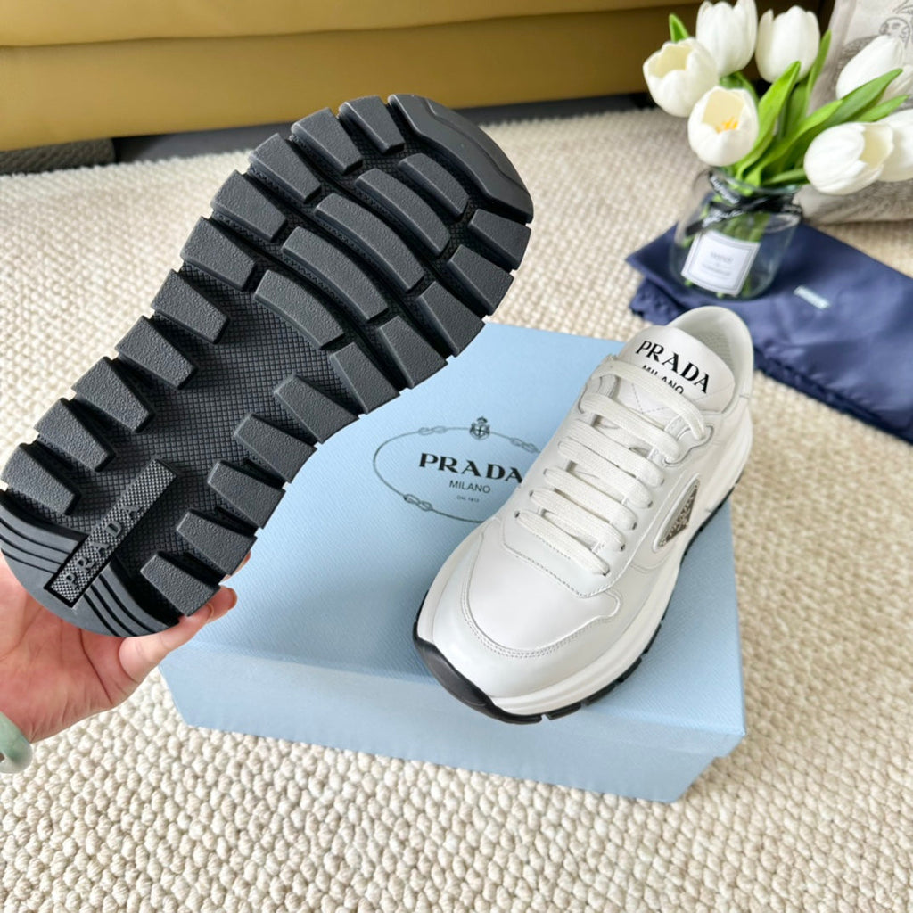 PRADA THICK SOLE SNEAKER WHITE AND BLACK LOGO CALFSKIN